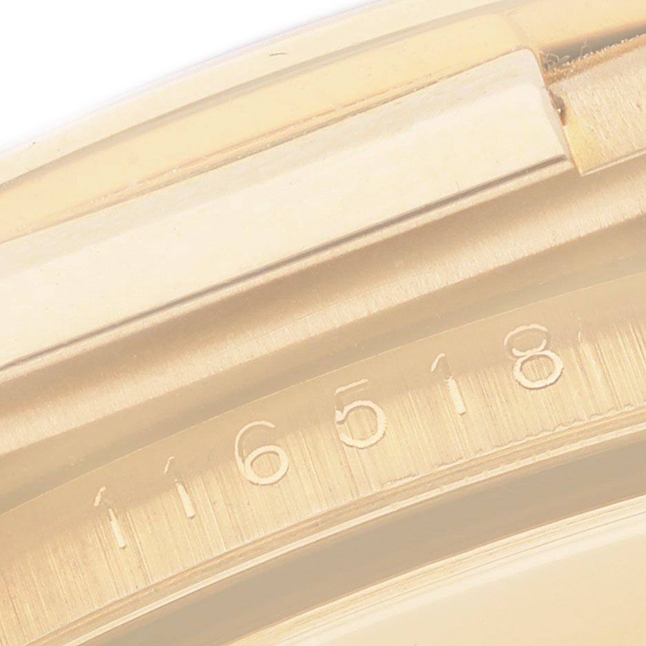 The image shows a close-up of the side of the Rolex Daytona 116518 Men's Yellow Gold Black Dial 116518 Men's Yellow Gold Black Dial, highlighting its engraved serial number.