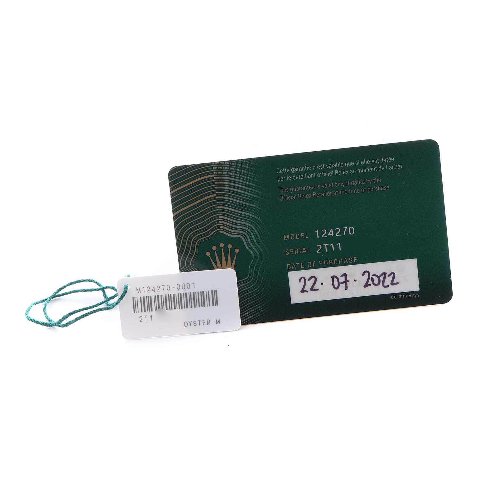 The image shows a warranty card for the Rolex Explorer 124270 Men's Stainless Steel Black Dial 124270 Men's Stainless Steel Black Dial model, displaying model and serial numbers, and a retail tag.