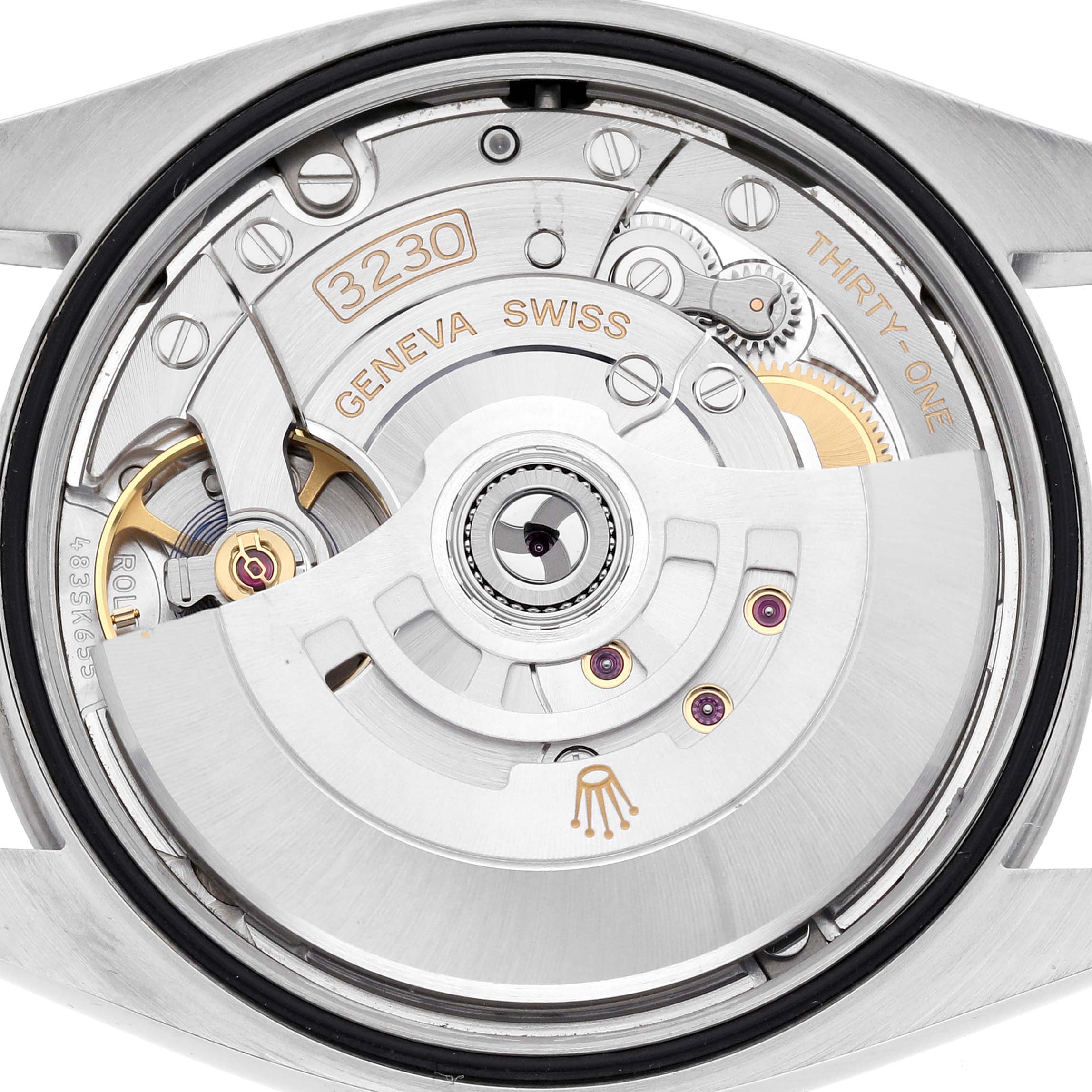 The image shows a close-up of the Rolex Explorer 124270 Men's Stainless Steel Black Dial 124270 Men's Stainless Steel Black Dial's movement, focusing on the intricate gears and components from a top angle.