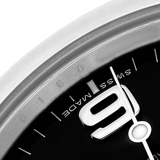 The image shows a close-up of the Rolex Explorer 214270 Men's Stainless Steel Black Dial's dial, focusing on the number 9 and part of the bezel.