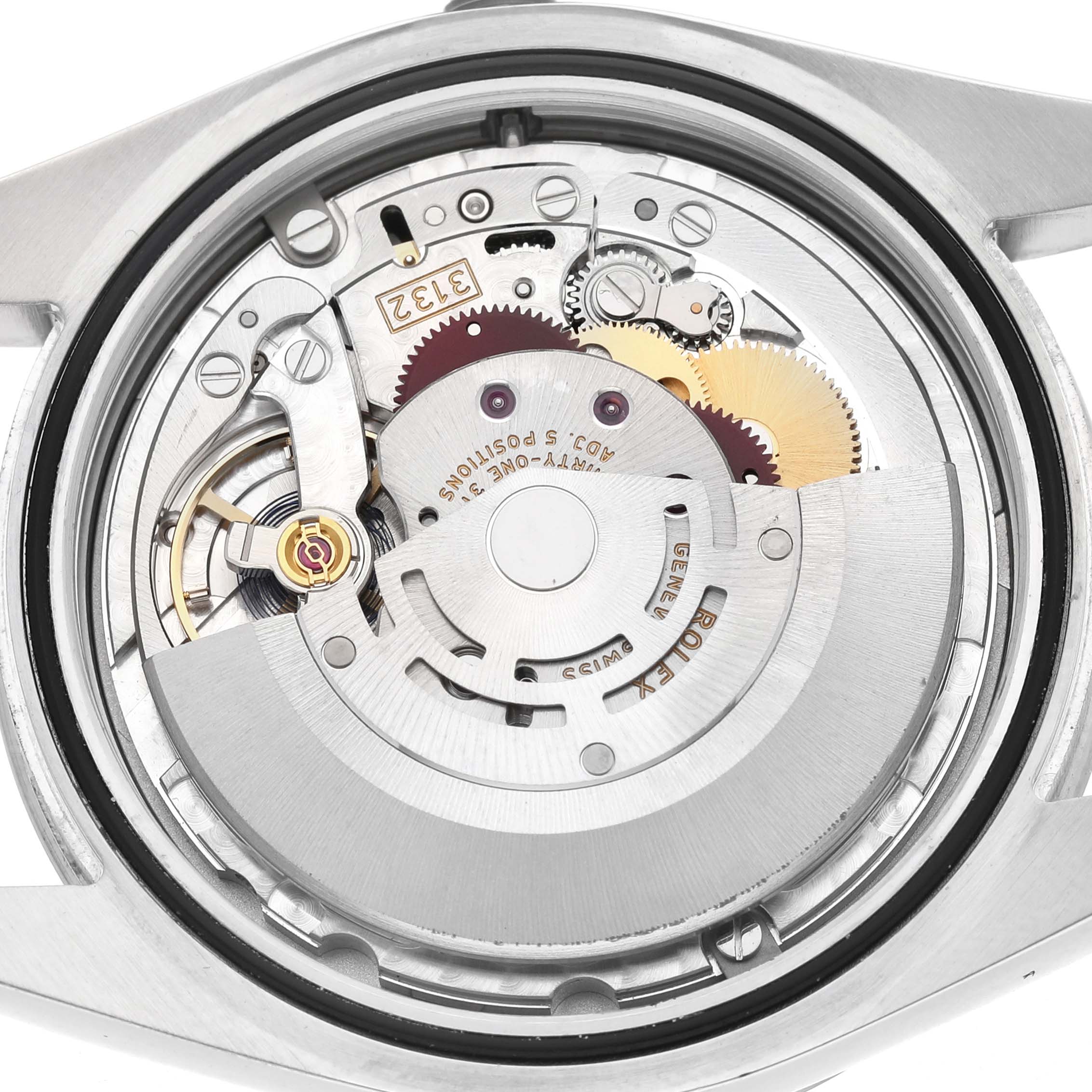The image shows the movement inside a Rolex Explorer 214270 Men's Stainless Steel Black Dial watch from a top-down view, featuring gears and the rotor.