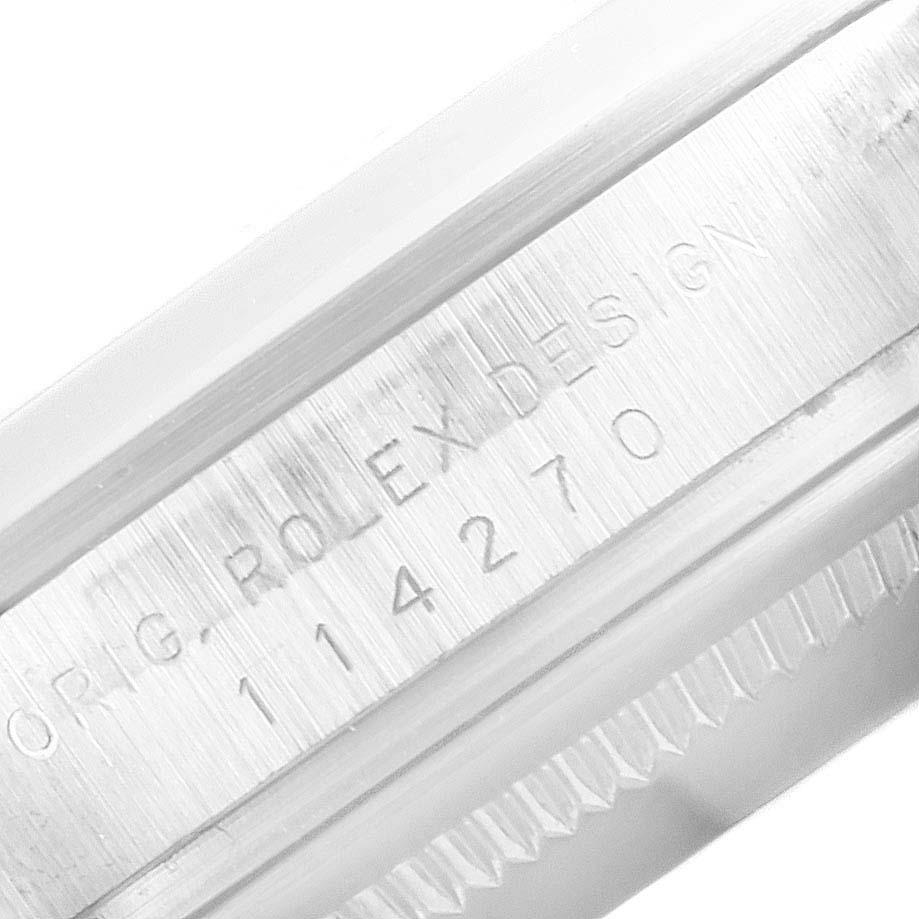 This image shows the side view of the bezel with the model and serial number engraved on the Rolex Explorer 114270 Men's Stainless Steel Black Dial 114270 Men's Stainless Steel Black Dial watch.