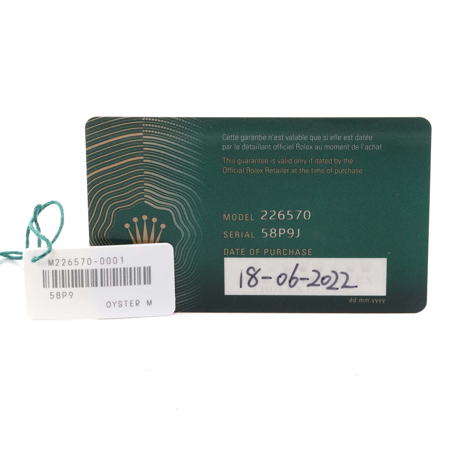 This image shows a warranty card and a tag for a Rolex Explorer 226570 Men
s Stainless Steel White Dial 226570 Men
s Stainless Steel White Dial model with details including the model number, serial number, and purchase date.