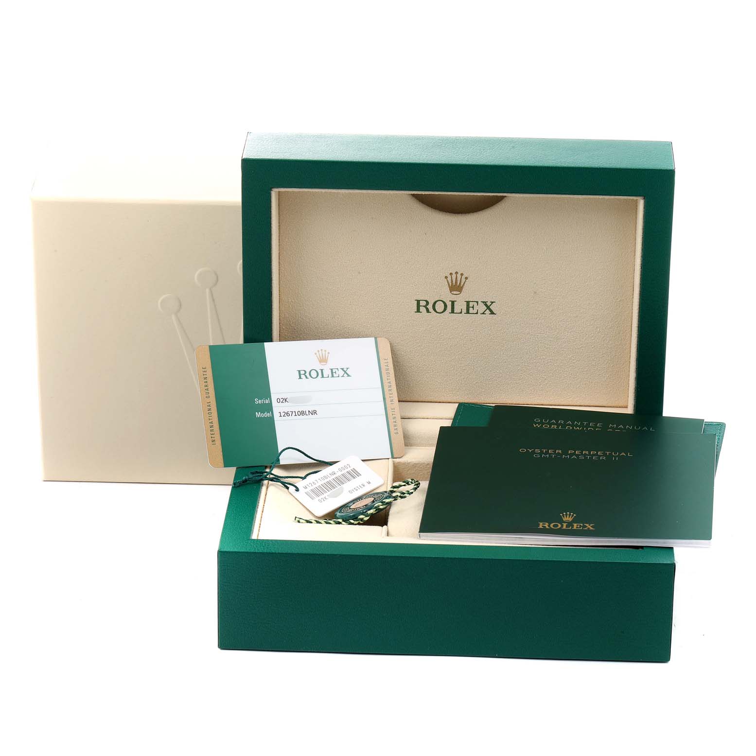 The image shows the packaging, manuals, and certification card for a Rolex GMT-Master 126710 Men
s Stainless Steel Black Dial 126710 Men
s Stainless Steel Black Dial watch laid out neatly.