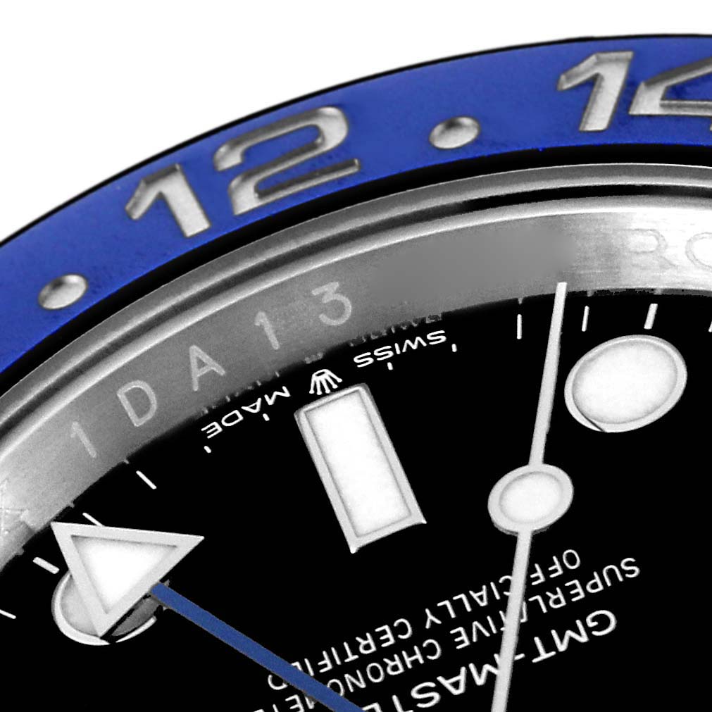 This close-up shot of a Rolex GMT-Master 126710 Men
s Stainless Steel Black Dial 126710 Men
s Stainless Steel Black Dial watch showcases part of its blue bezel, black dial, hands, and hour markers.
