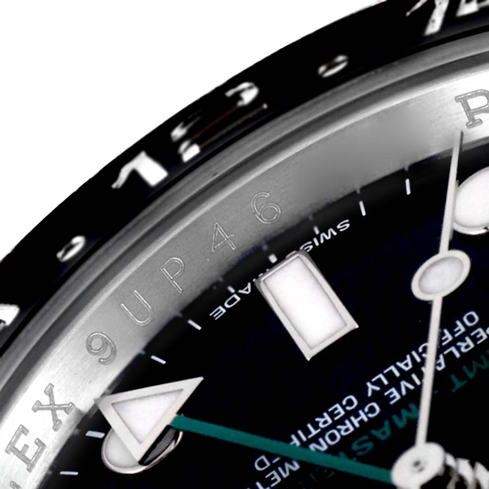 This close-up image shows the bezel, part of the dial, and the GMT hand of a Rolex GMT-Master 116710 Men
s Stainless Steel Black Dial 116710 Men
s Stainless Steel Black Dial watch.