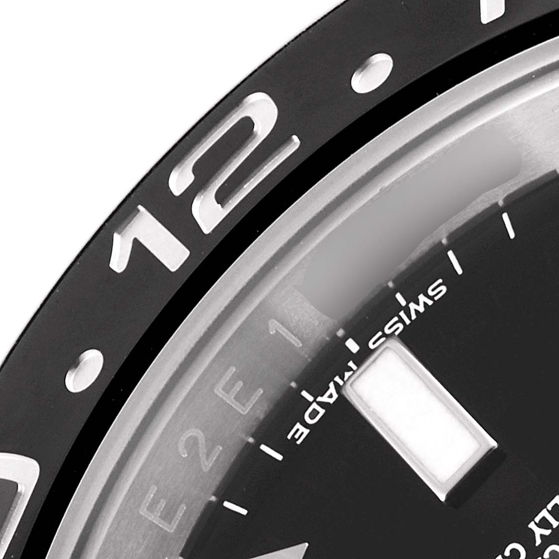The image shows a close-up of the bezel and part of the dial of a Rolex GMT-Master 116710 Men's Stainless Steel Black Dial 116710 Men's Stainless Steel Black Dial watch.