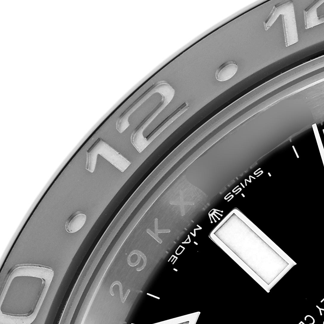 The image shows a close-up of the bezel and part of the dial of a Rolex GMT-Master 126710GRNR Men's Stainless Steel Black Dial 126710GRNR Men's Stainless Steel Black Dial, focusing on the "12" marker.