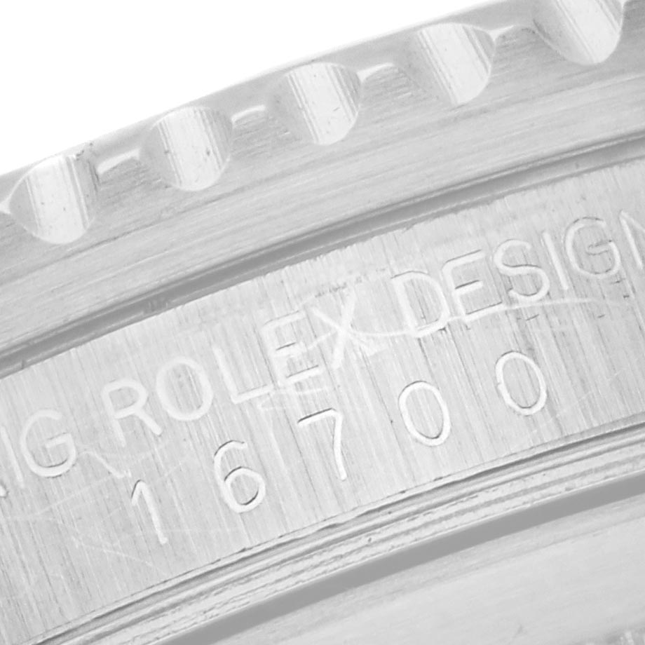 The image shows a close-up of the case side of a Rolex GMT-Master 16700 Men's Stainless Steel Black Dial 16700 Men's Stainless Steel Black Dial, featuring the engraving "ORIG ROLEX DESIGN 16700."