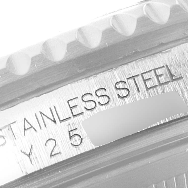 This image shows the side view of the Rolex GMT-Master 16710 Men
s Stainless Steel Black Dial 16710 Men
s Stainless Steel Black Dial model, highlighting the serial number and reference to "STAINLESS STEEL."