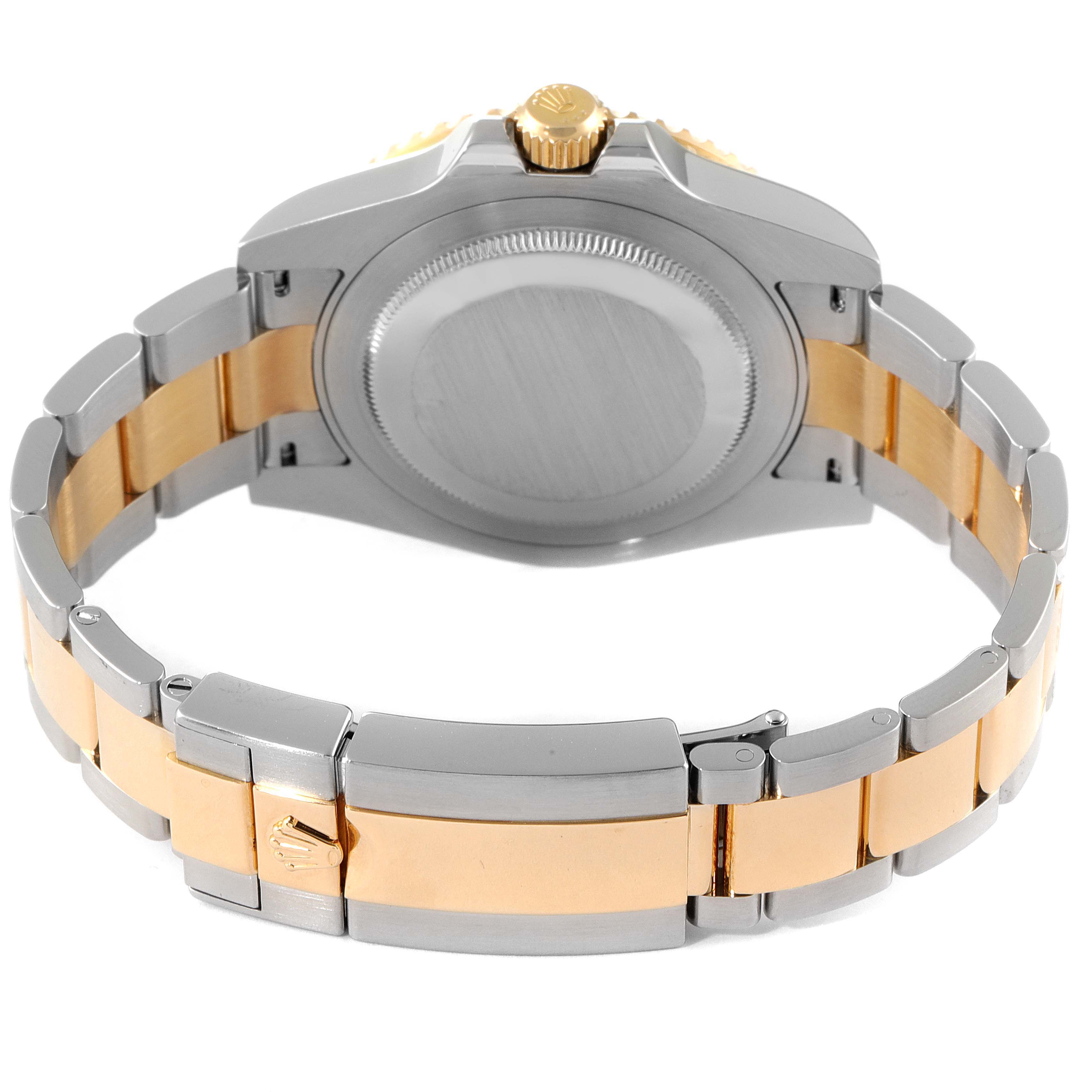 This image shows the back and clasp of a Rolex GMT-Master 116713 Men's Steel and Gold (two tone) Black Dial 116713 Men's Steel and Gold (two tone) Black Dial watch in a two-tone metal design.