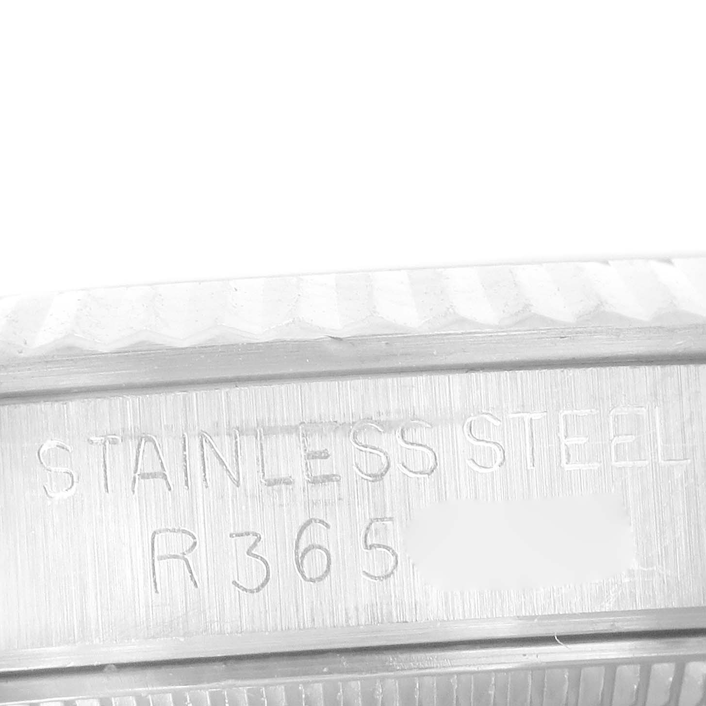 This image shows an engraved side view of the caseback of a Rolex Mid-Size 67514 Women
s Stainless Steel White Dial 67514 Women
s Stainless Steel White Dial stainless steel watch.