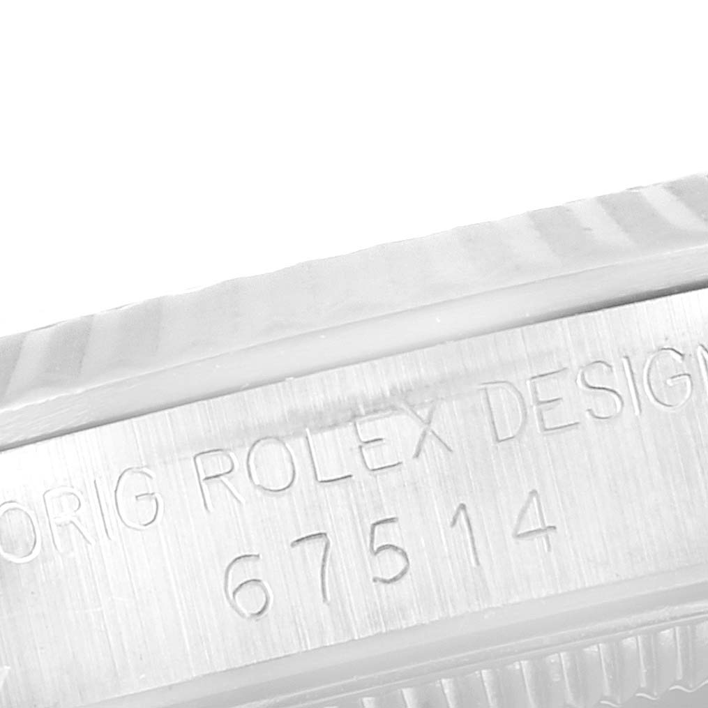 The image shows a close-up of the side engraving on a Rolex Mid-Size 67514 Women
s Stainless Steel White Dial 67514 Women
s Stainless Steel White Dial watch, revealing the model number "67514."