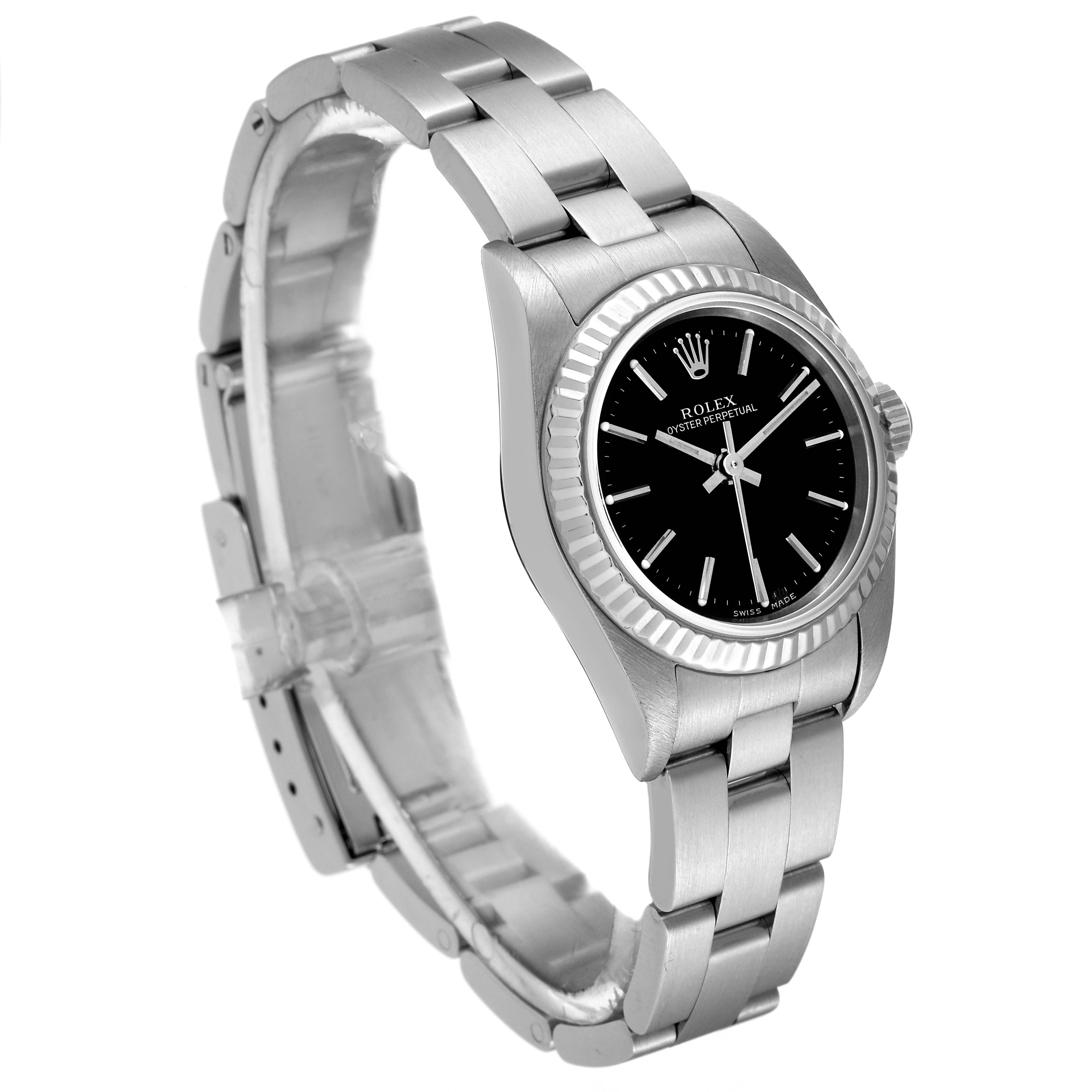 The image shows a Rolex Oyster Perpetual 76094 Women
s Stainless Steel Black Dial 76094 Women
s Stainless Steel Black Dial watch from a three-quarter angle, highlighting the face, bezel, and bracelet.