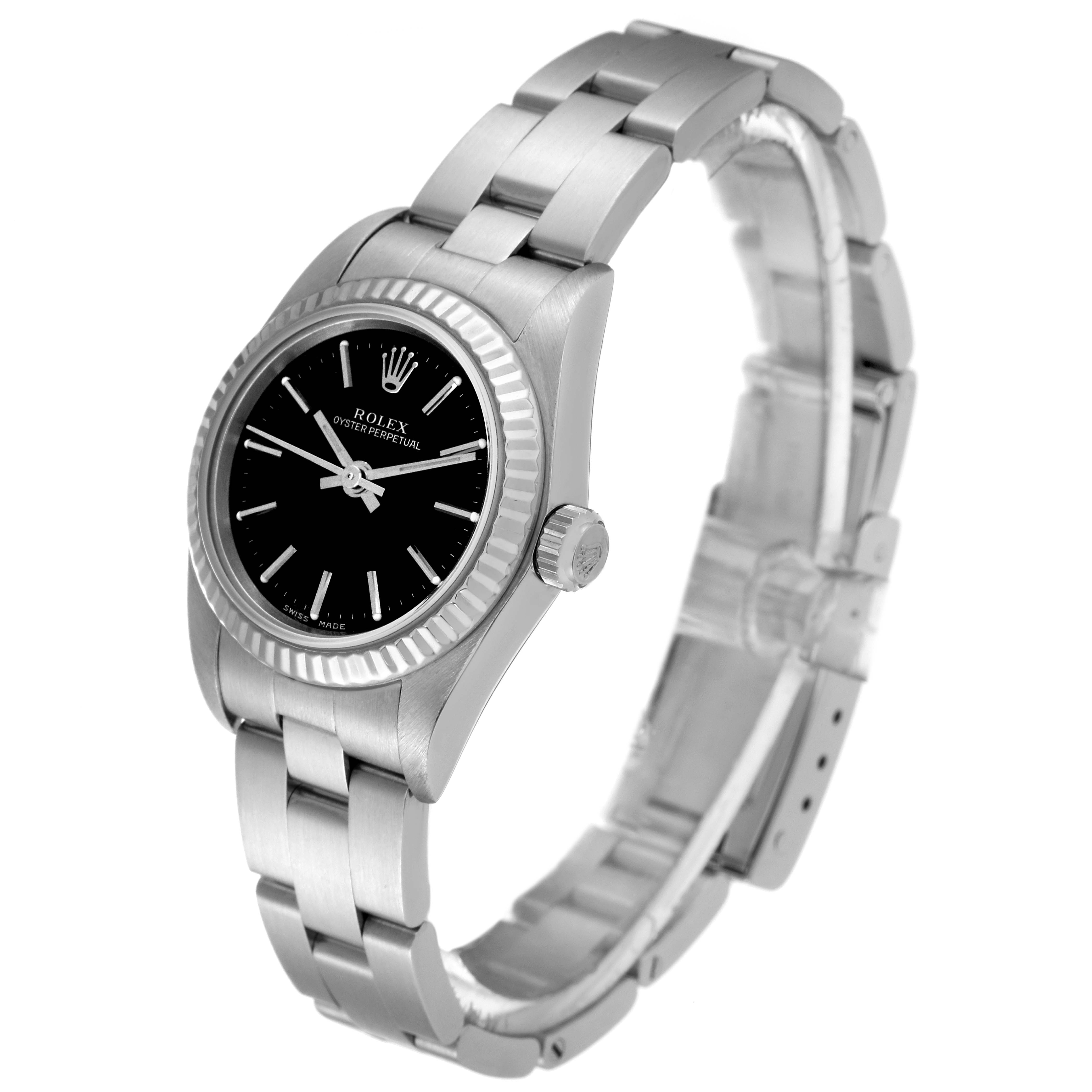 The Rolex Oyster Perpetual 76094 Women
s Stainless Steel Black Dial 76094 Women
s Stainless Steel Black Dial watch is shown at a three-quarters angle, displaying the face, bezel, crown, and bracelet.