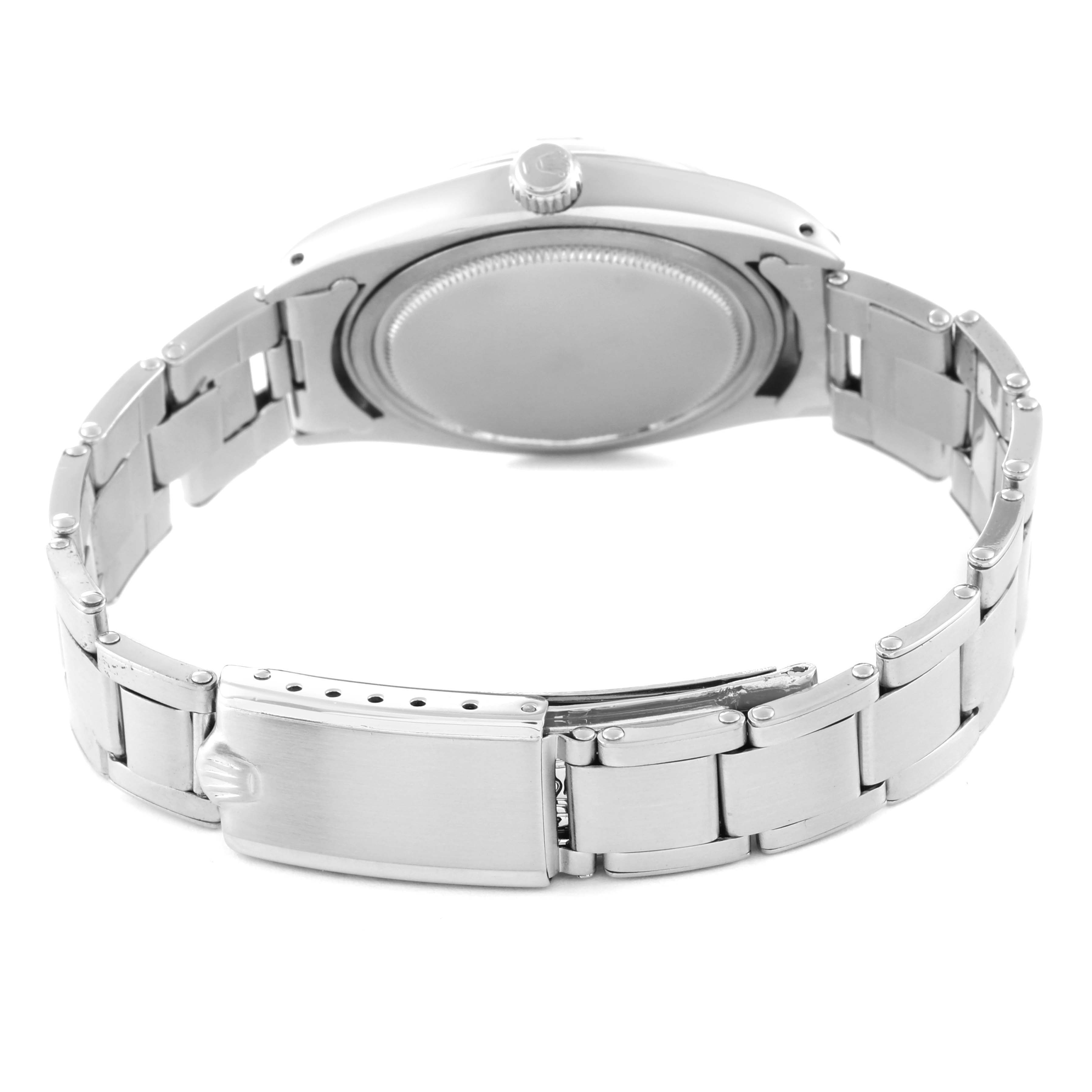 This image shows the back case and metal bracelet of the Rolex Vintage Collection 6694 Men's Stainless Steel Black Dial 6694 Men's Stainless Steel Black Dial model watch.