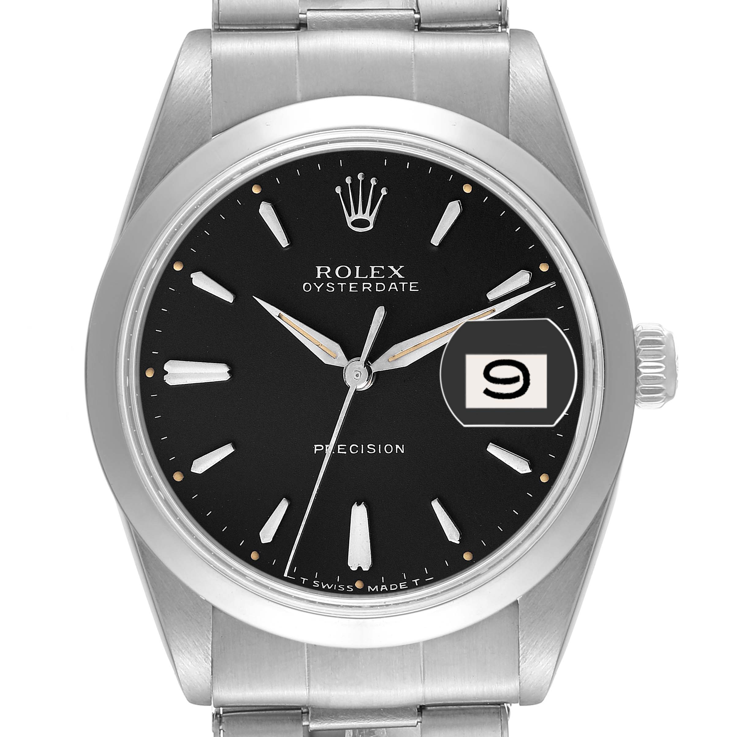 The image shows a front view of the Rolex Vintage Collection 6694 Men's Stainless Steel Black Dial 6694 Men's Stainless Steel Black Dial model Oysterdate's dial, hands, crown, and part of the bracelet.