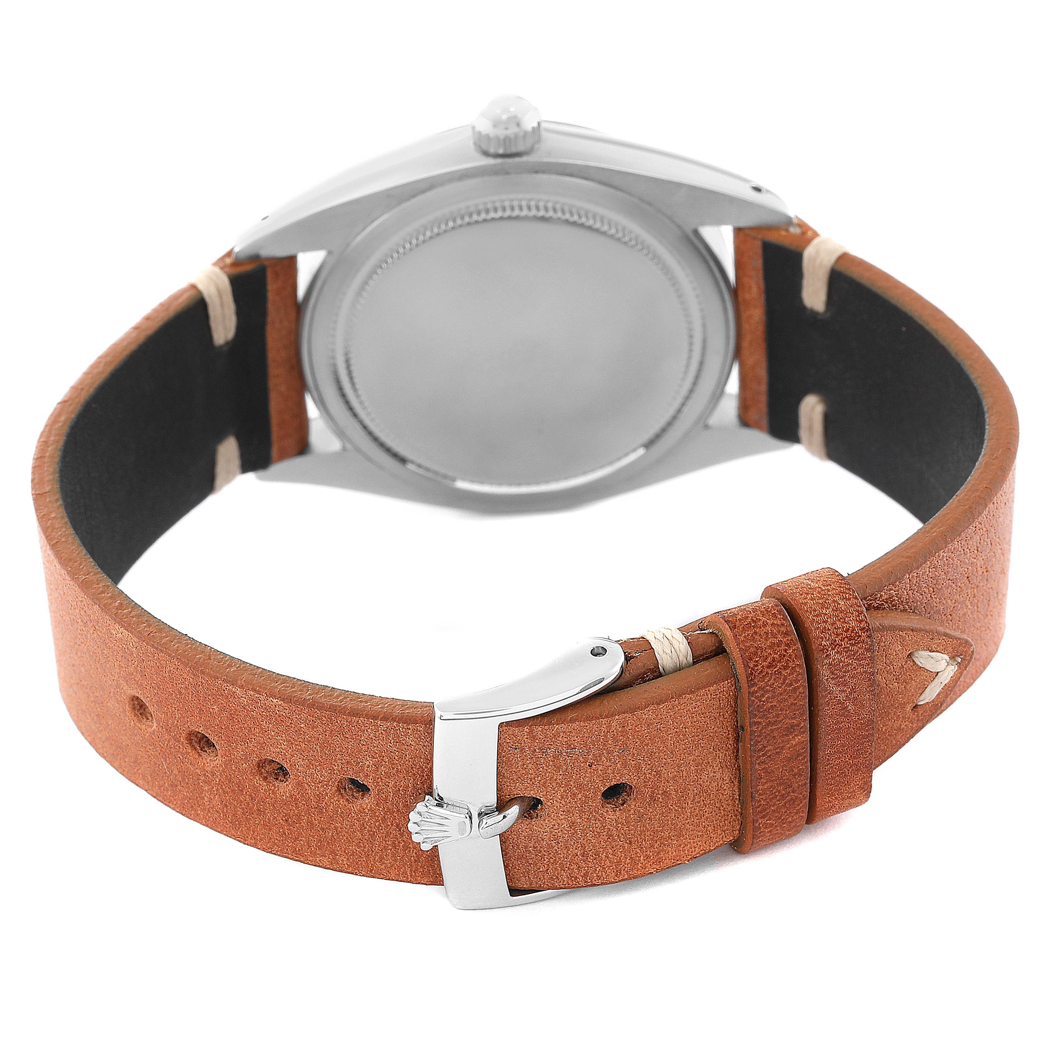 This image shows the back casing and leather strap with a clasp of a Rolex Vintage Collection 6694 Men's Stainless Steel Silver Dial 6694 Men's Stainless Steel Silver Dial watch from a rear angle.