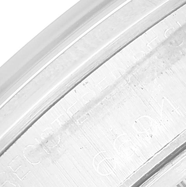 This close-up photo shows the engraved outer edge of a Vintage Collection Rolex watch case.