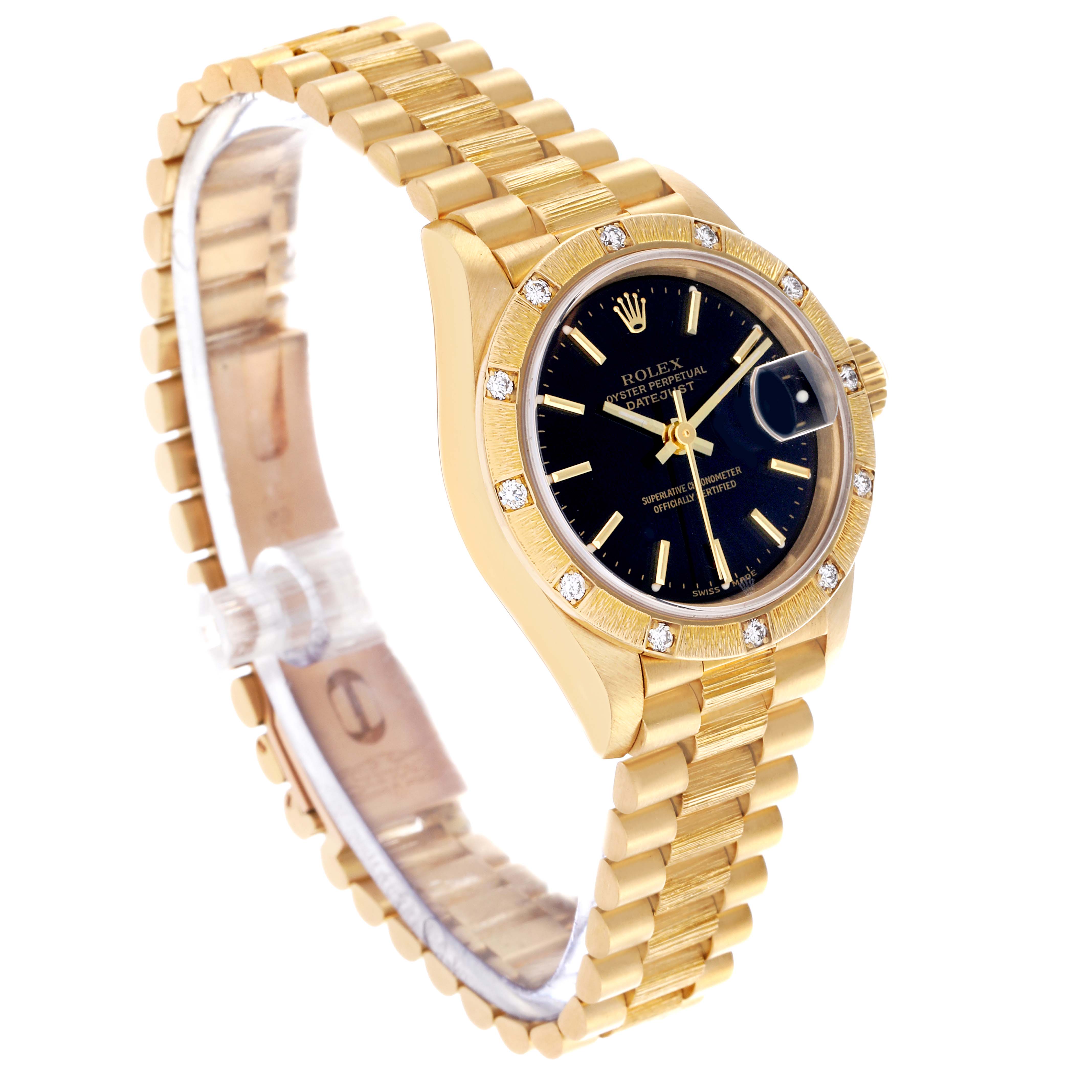 The Rolex President 69288 Women's Yellow Gold Black Dial 69288 Women's Yellow Gold Black Dial watch is shown at a slight angle, highlighting the bracelet, bezel with diamonds, and the dial with a date display.