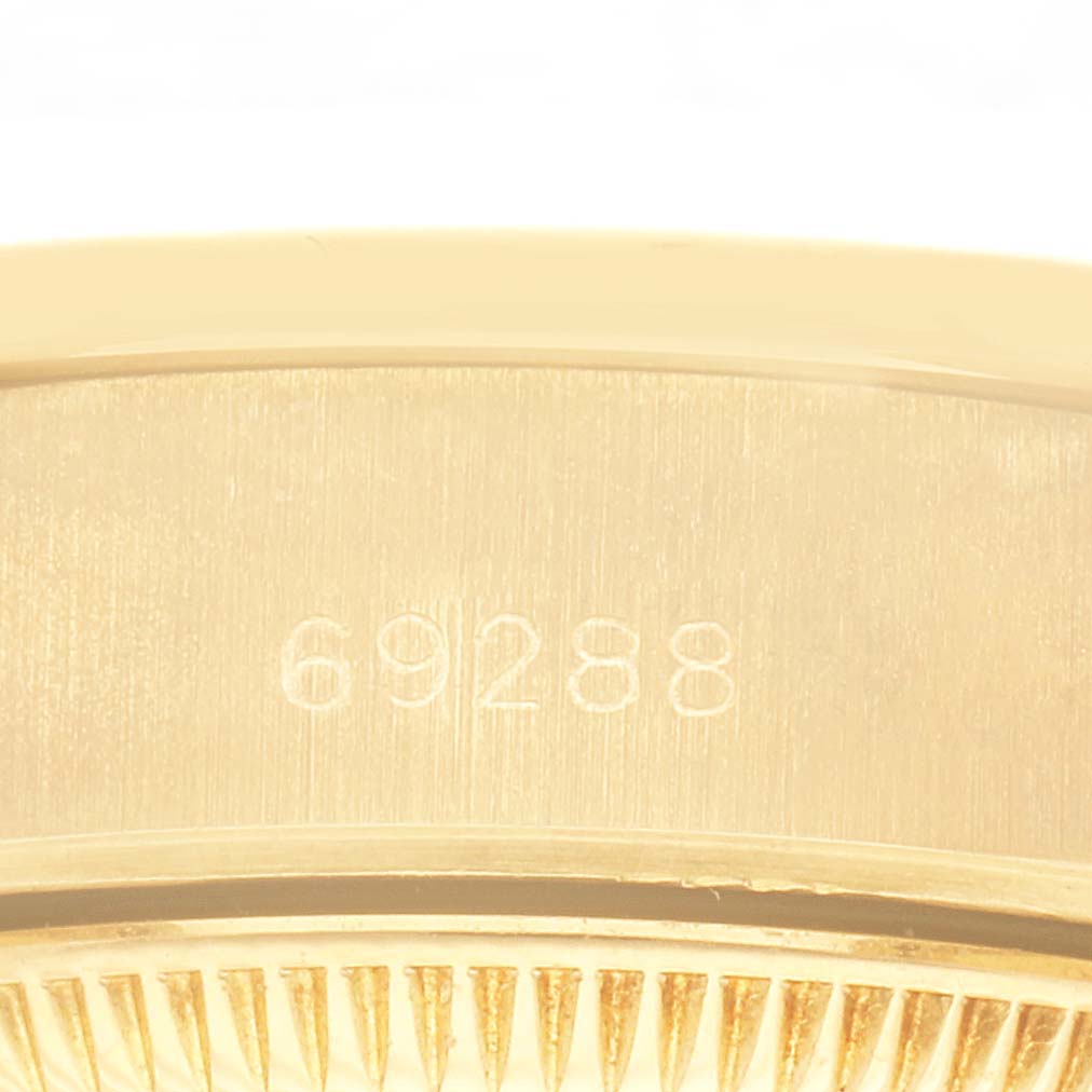 The image shows a close-up of the Rolex President 69288 Women's Yellow Gold Black Dial 69288 Women's Yellow Gold Black Dial model's case, displaying the reference number "69288."