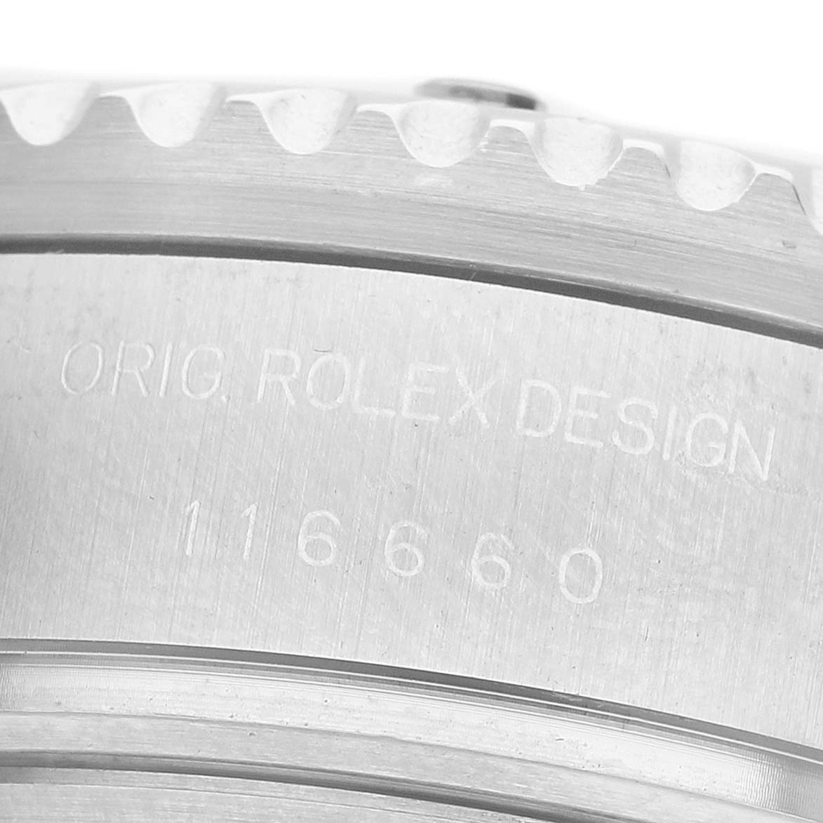 The image shows a close-up of the Rolex Sea-Dweller 116660 Men's Stainless Steel Black Dial watch case, focusing on the inscription and reference number.
