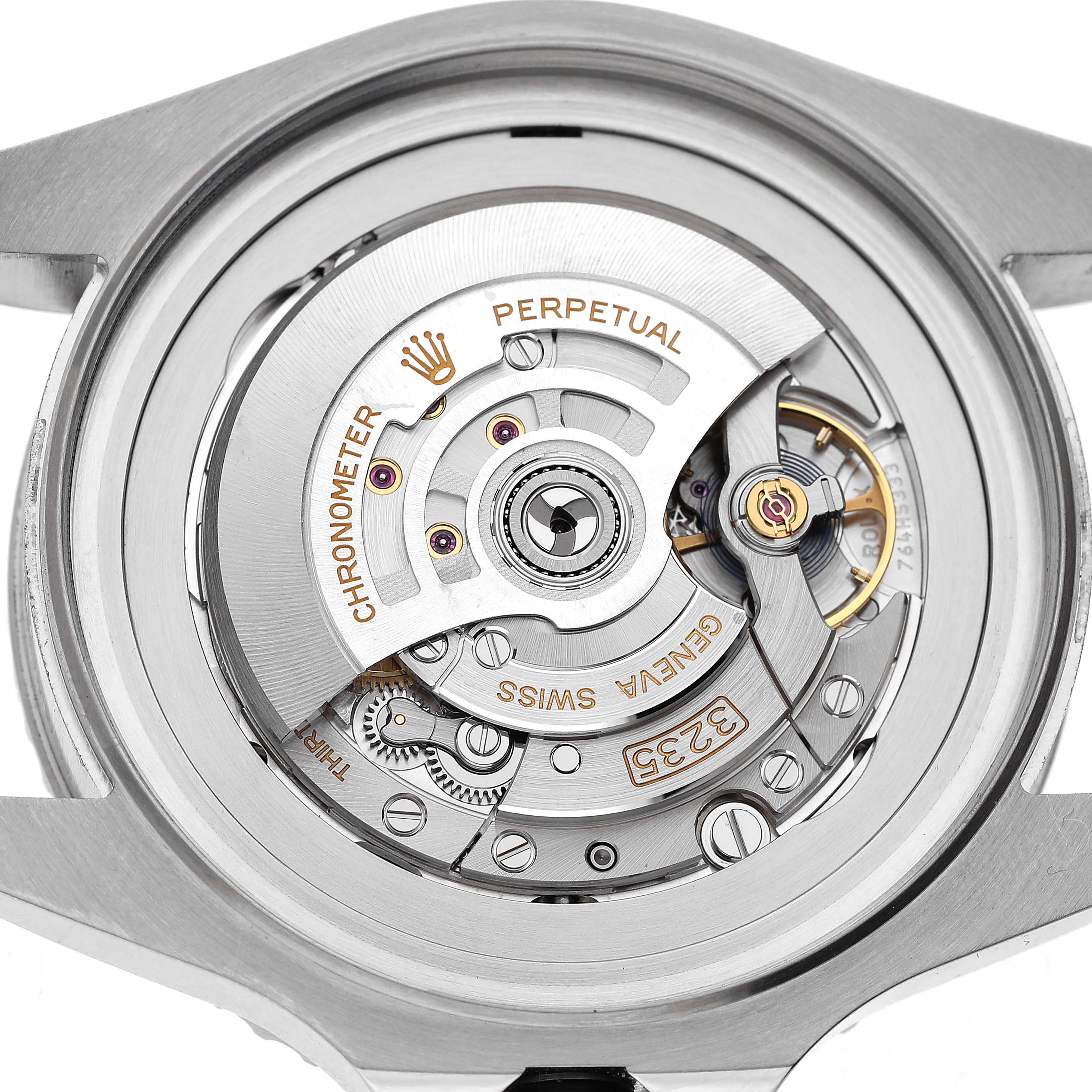 The image shows the Rolex Sea-Dweller 136660 Men's Stainless Steel Black Dial's movement from a rear angle, highlighting the rotor and intricate mechanical components.