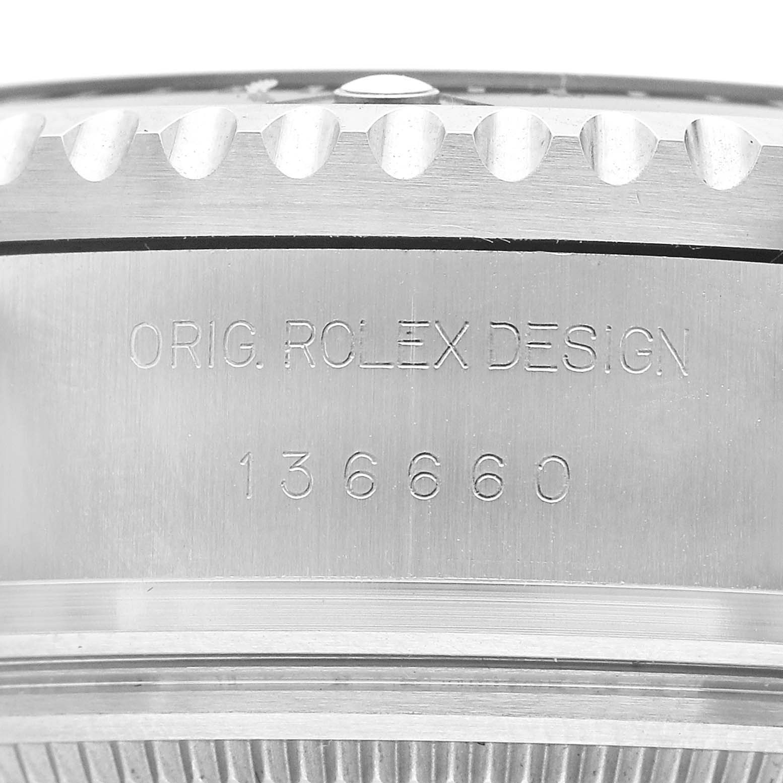 The image shows a detailed close-up of the side of a Rolex Sea-Dweller 136660 Men's Stainless Steel Black Dial watch, highlighting the engraved model number and brand name.