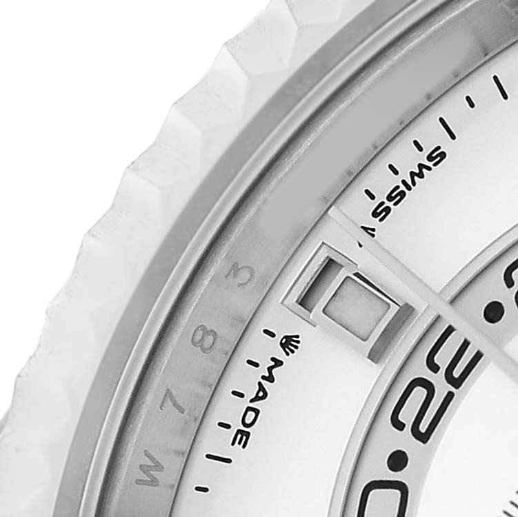 The image shows a close-up of the Rolex Sky-Dweller 336239 Men's White Gold White Dial watch, highlighting part of the dial and bezel with the date and markings.