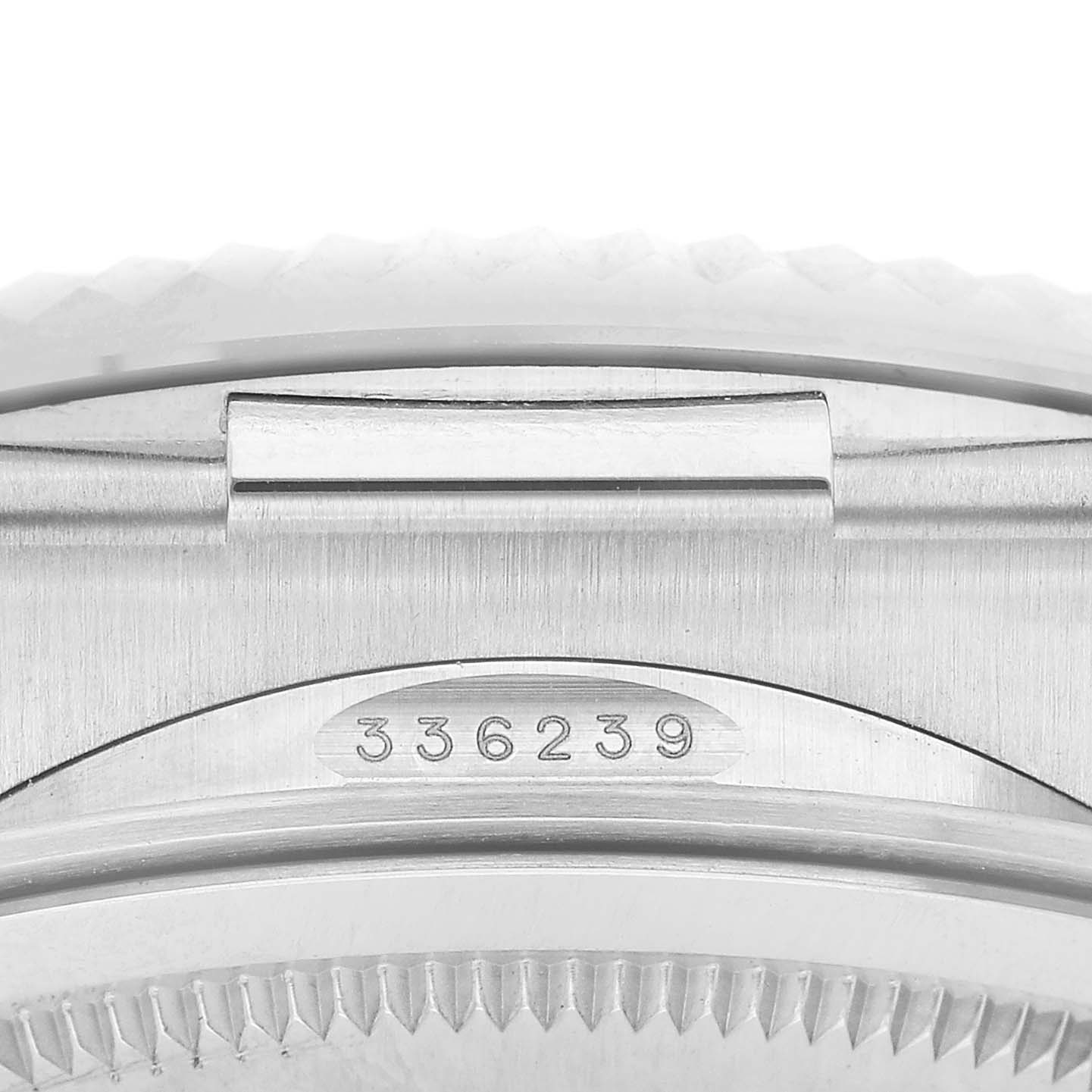 The image shows a close-up of the side of a Rolex Sky-Dweller 336239 Men's White Gold White Dial, highlighting the serial number and part of the case.