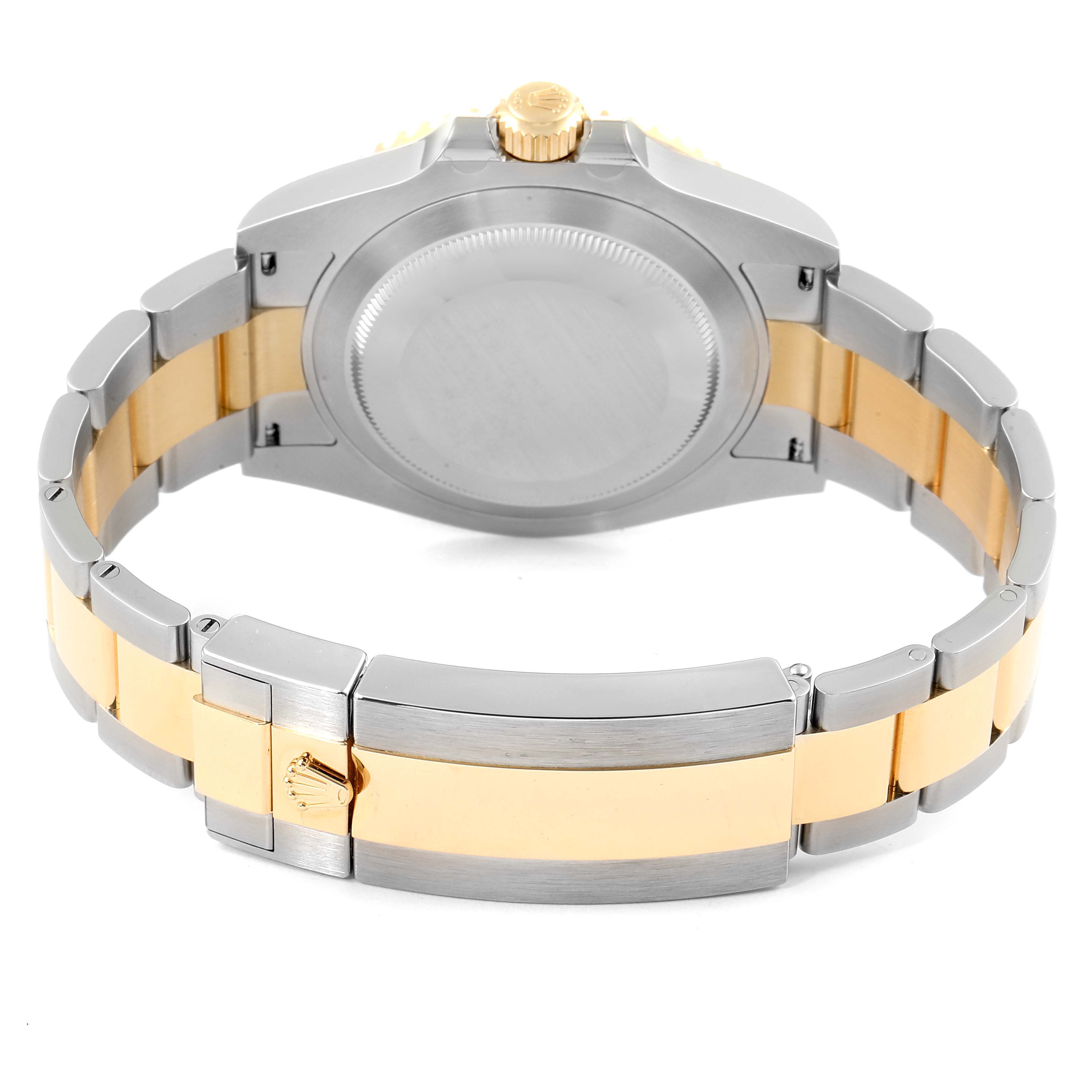 This image shows the back of a Rolex Submariner 126613 Men's Steel and Gold (two tone) Black Dial 126613 Men's Steel and Gold (two tone) Black Dial watch, highlighting the case back and two-tone bracelet with a clasp.