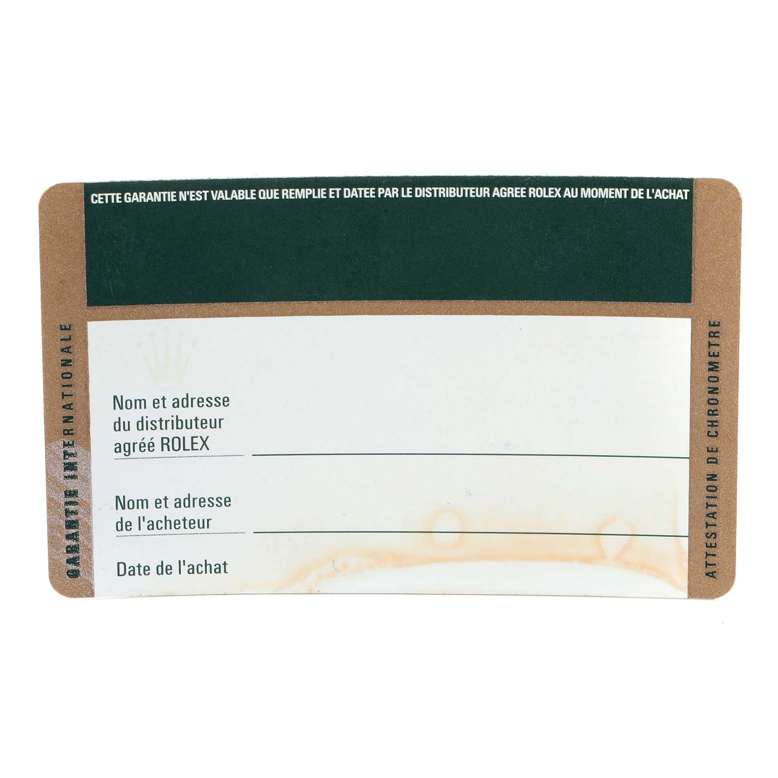 This image shows a top-down view of the warranty card for a Rolex Submariner 116618 Men's Yellow Gold Black Dial 116618 Men's Yellow Gold Black Dial watch.