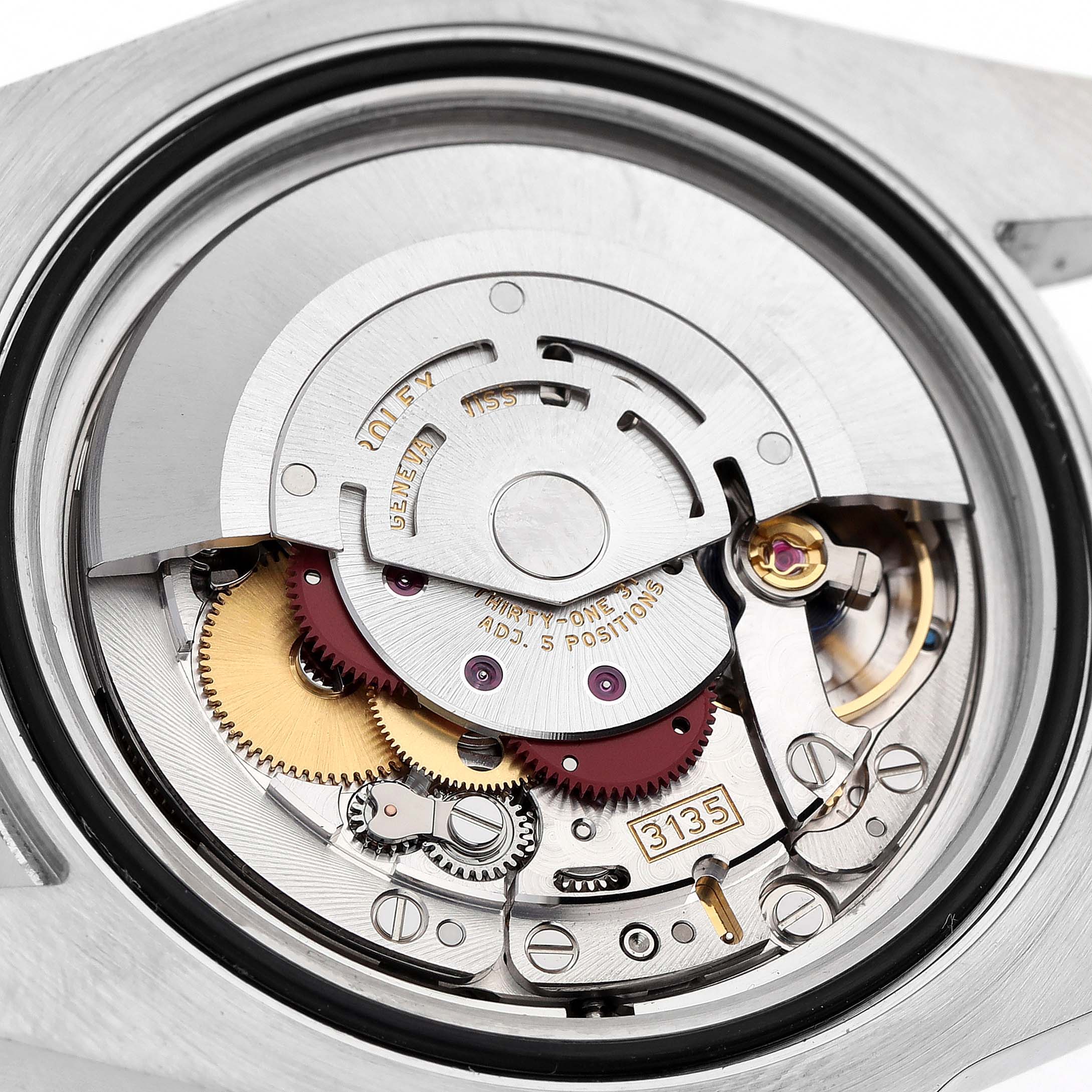 The image shows the movement of a Rolex Submariner 116610 Men's Stainless Steel Black Dial, indicating gears and the rotor from the back view.