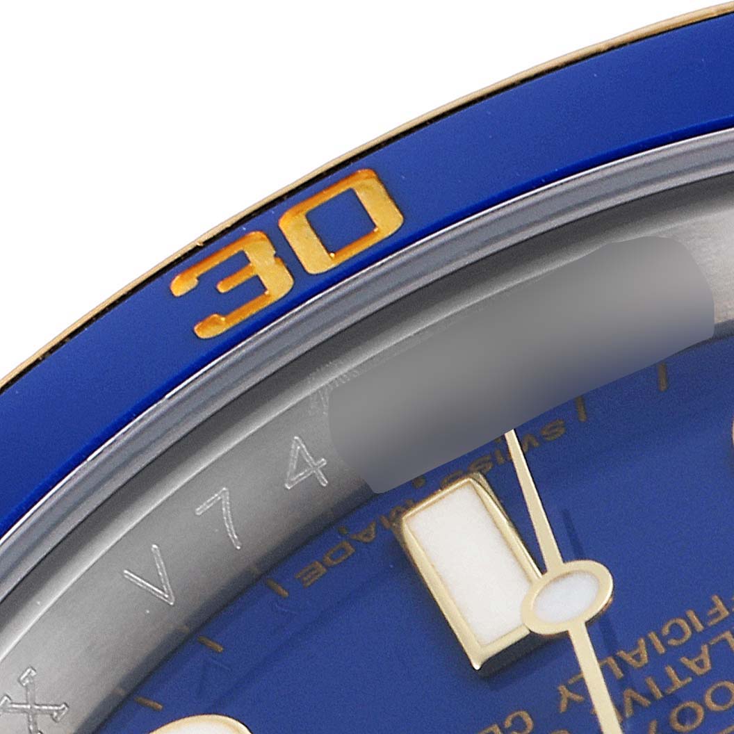 The image shows a close-up of the bezel and dial of a Rolex Submariner 116613 Men's Steel and Gold (two tone) Blue Dial 116613 Men's Steel and Gold (two tone) Blue Dial watch, highlighting the 30-minute marker and part of the hour hand.