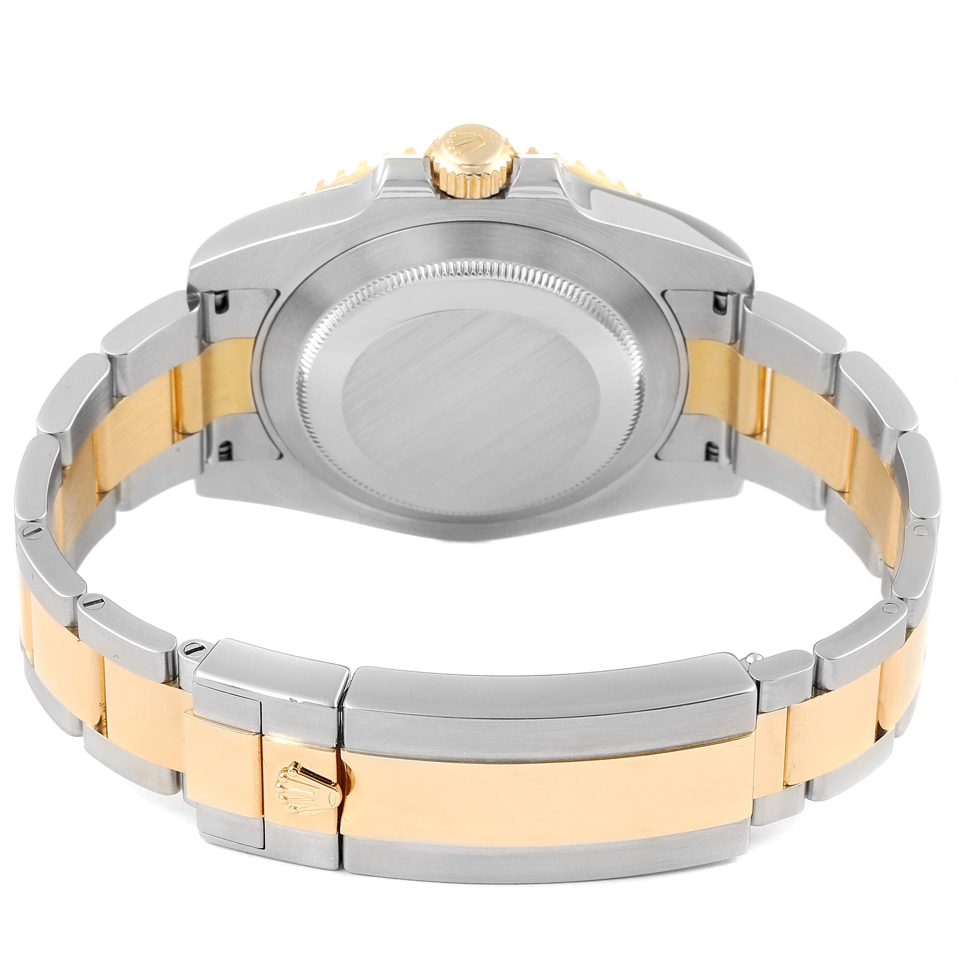 The image shows the back view of a Rolex Submariner 116613 Men's Steel and Gold (two tone) Blue Dial 116613 Men's Steel and Gold (two tone) Blue Dial watch, highlighting the case back, crown, and two-tone bracelet.