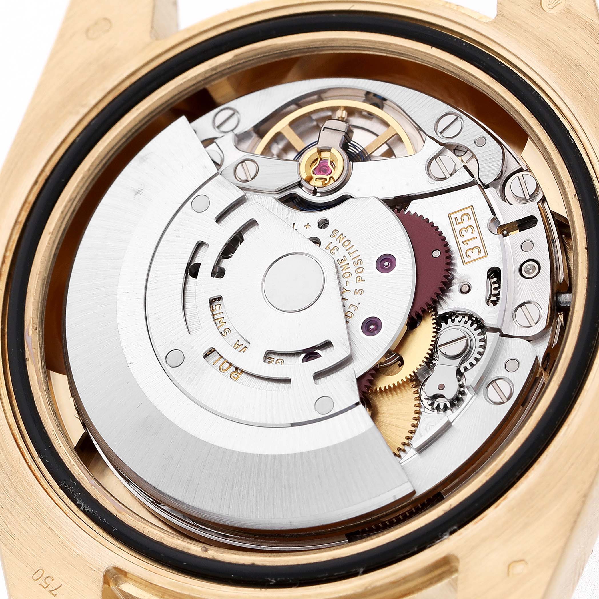 The image shows the movement mechanism of a Rolex Submariner 116618 Men's Yellow Gold Black Dial watch from a top-down angle, revealing gears and the rotor.