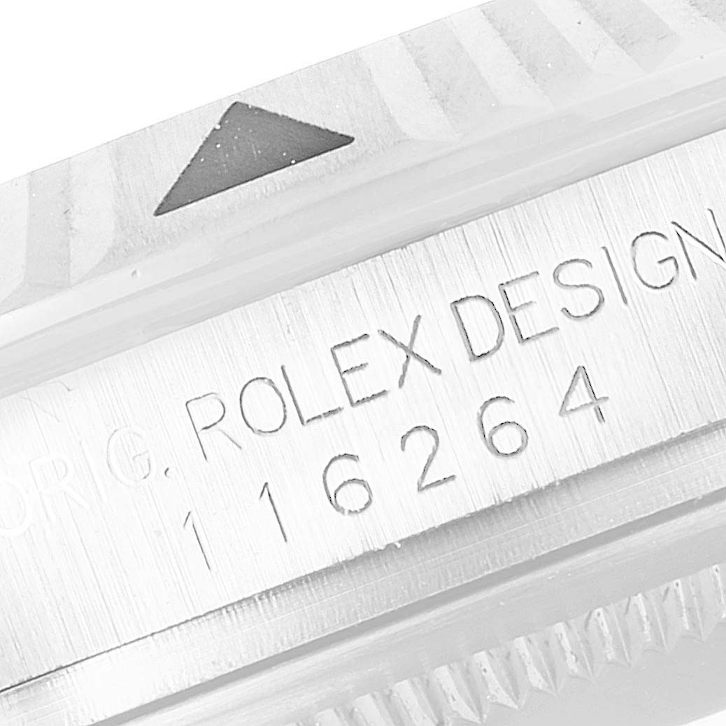 The image shows a close-up of the bezel and engraved serial number on the Rolex Turn-o-Graph 116264 Men's Stainless Steel White Dial 116264 Men's Stainless Steel White Dial watch.