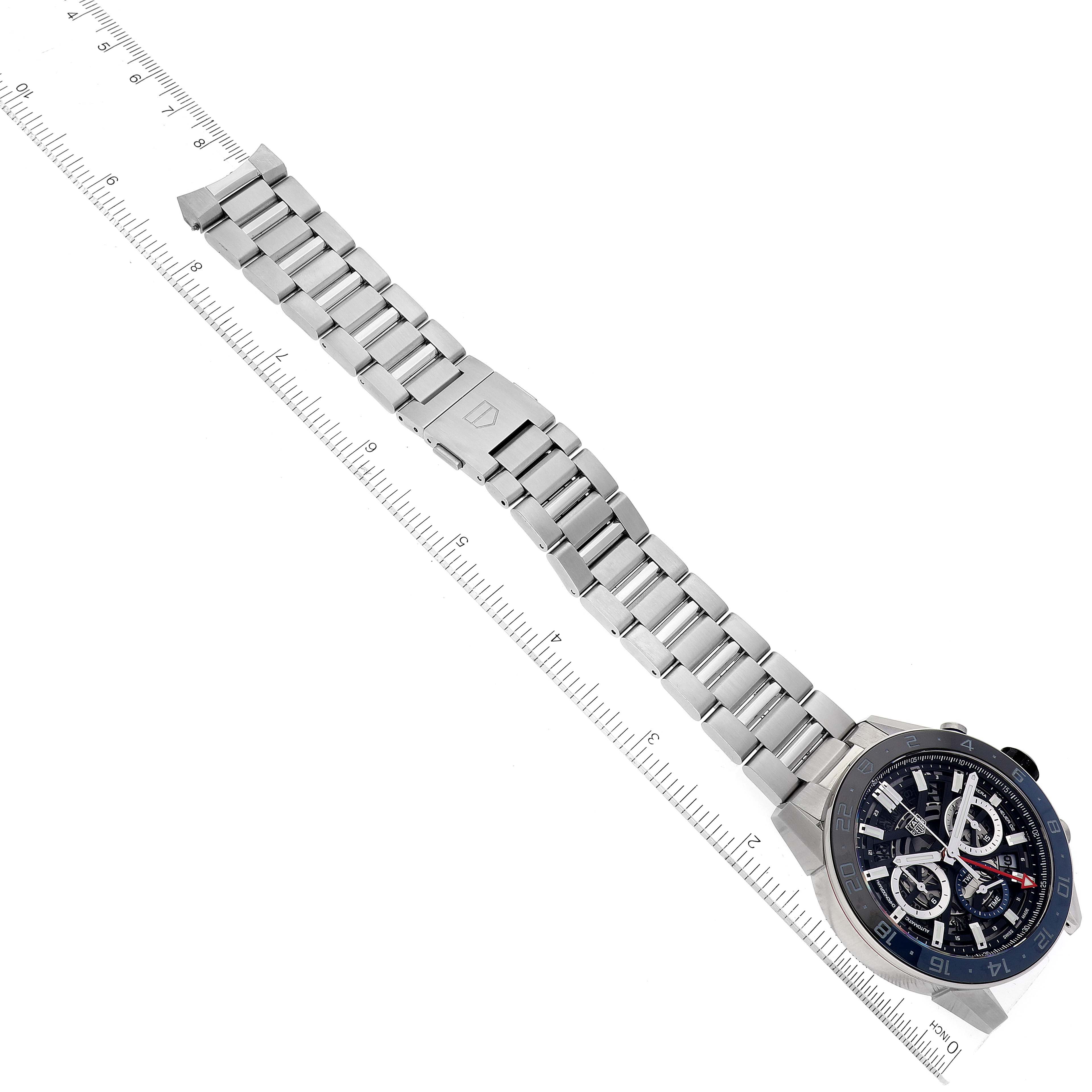 The image shows a top view of a Carrera model by Tag Heuer, displaying its face and stainless steel bracelet with a ruler for scale.