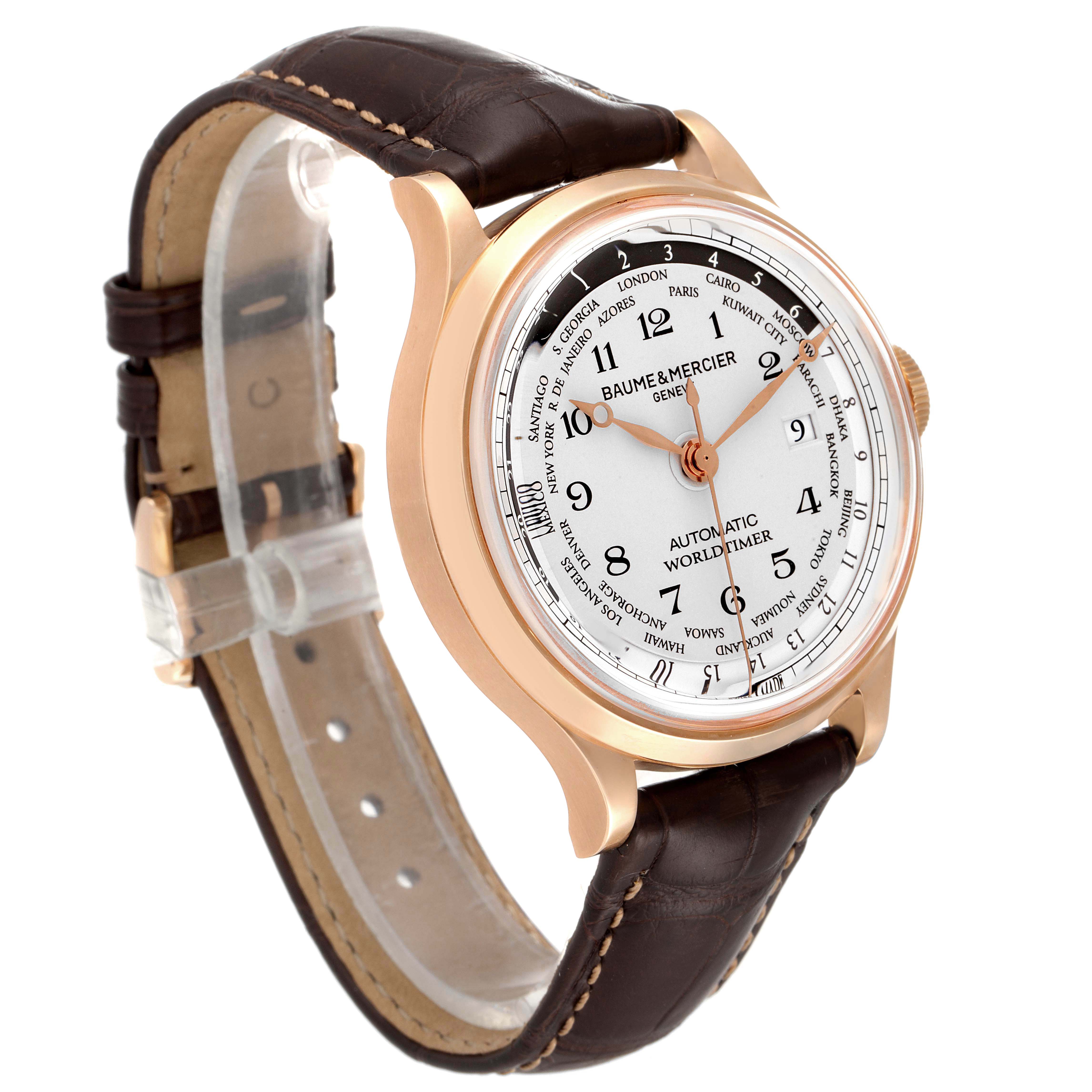 This Baume & Mercier Capeland M0A10107 Men's Rose Gold Silver Dial M0A10107 Men's Rose Gold Silver Dial watch is shown at a three-quarter angle, featuring its white dial, rose gold case, and brown leather strap.
