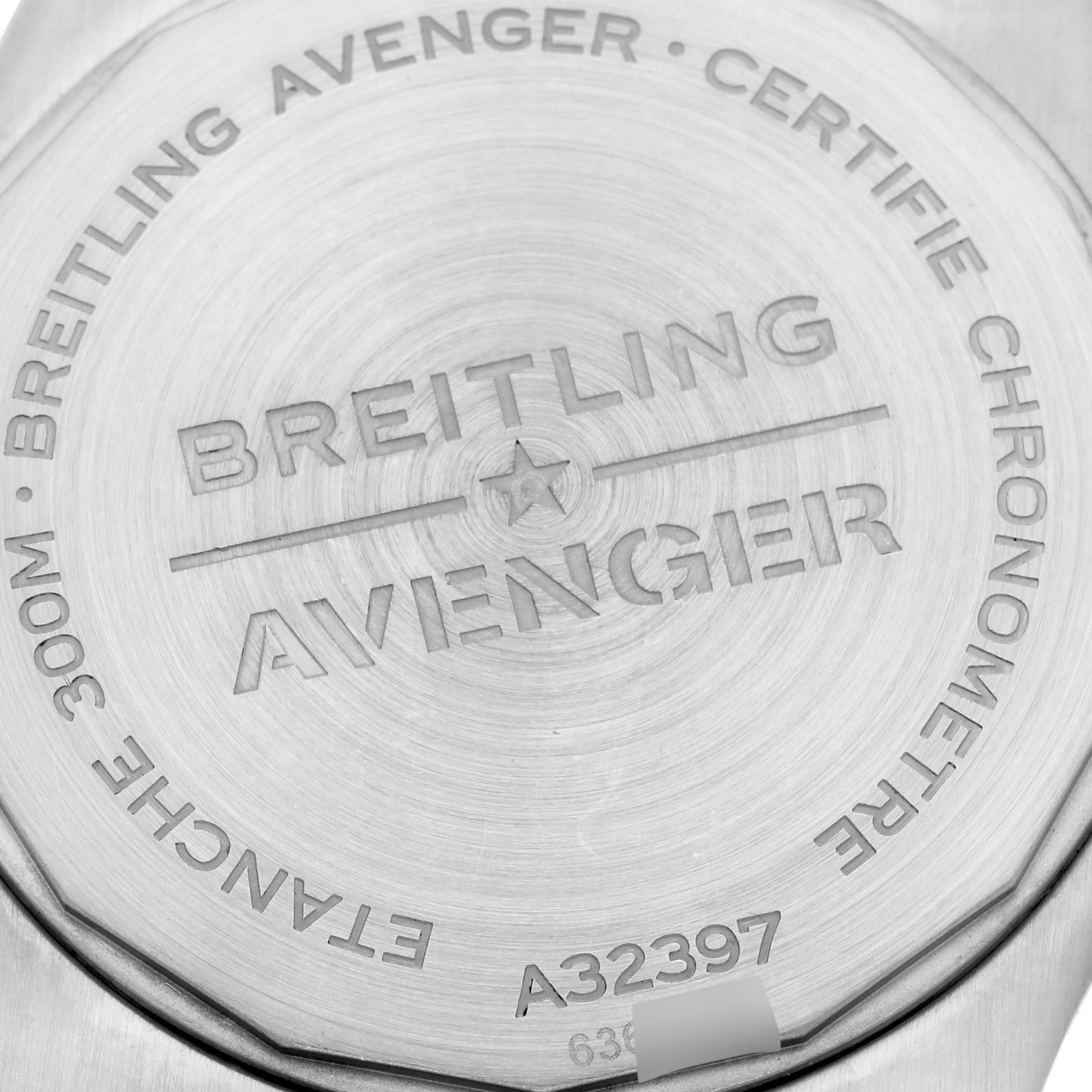 The image shows the back casing of a Breitling Avenger A32397 Men's Stainless Steel White Dial A32397 Men's Stainless Steel White Dial watch, highlighting engraving and model details.