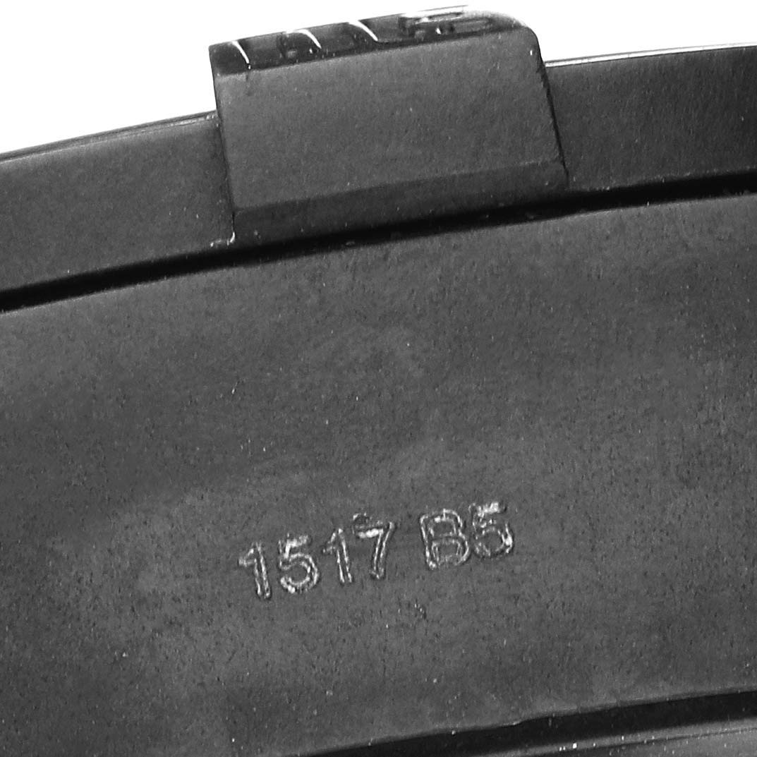 This image shows a close-up of the buckle clasp on a Breitling Avenger XB01701A/BF92 Men's Ceramic Black Dial XB01701A/BF92 Men's Ceramic Black Dial watch strap, highlighting its texture and stamped code.