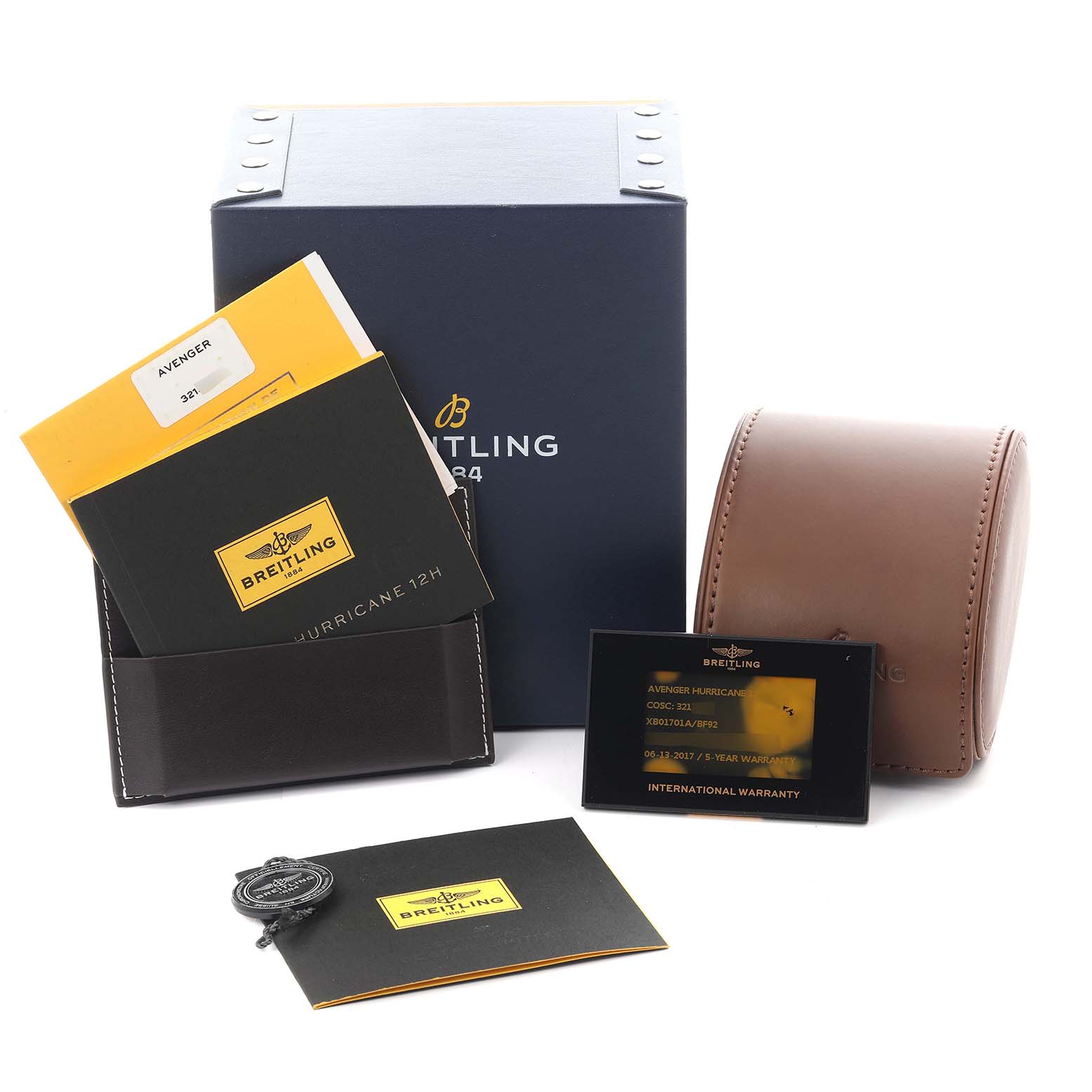 The image shows Breitling Avenger XB01701A/BF92 Men's Ceramic Black Dial XB01701A/BF92 Men's Ceramic Black Dial watch accessories, including manuals, a warranty card, and packaging at a slight top angle.