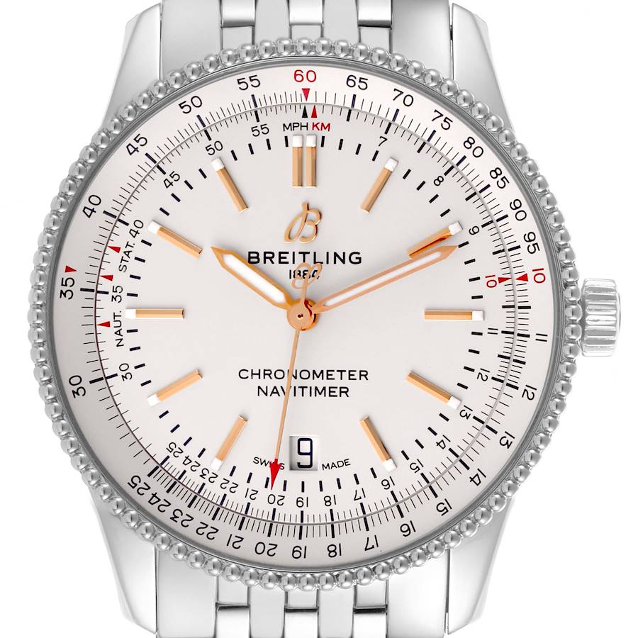 The Breitling Navitimer watch is shown from a front angle, highlighting the face, bezel, and metal bracelet.