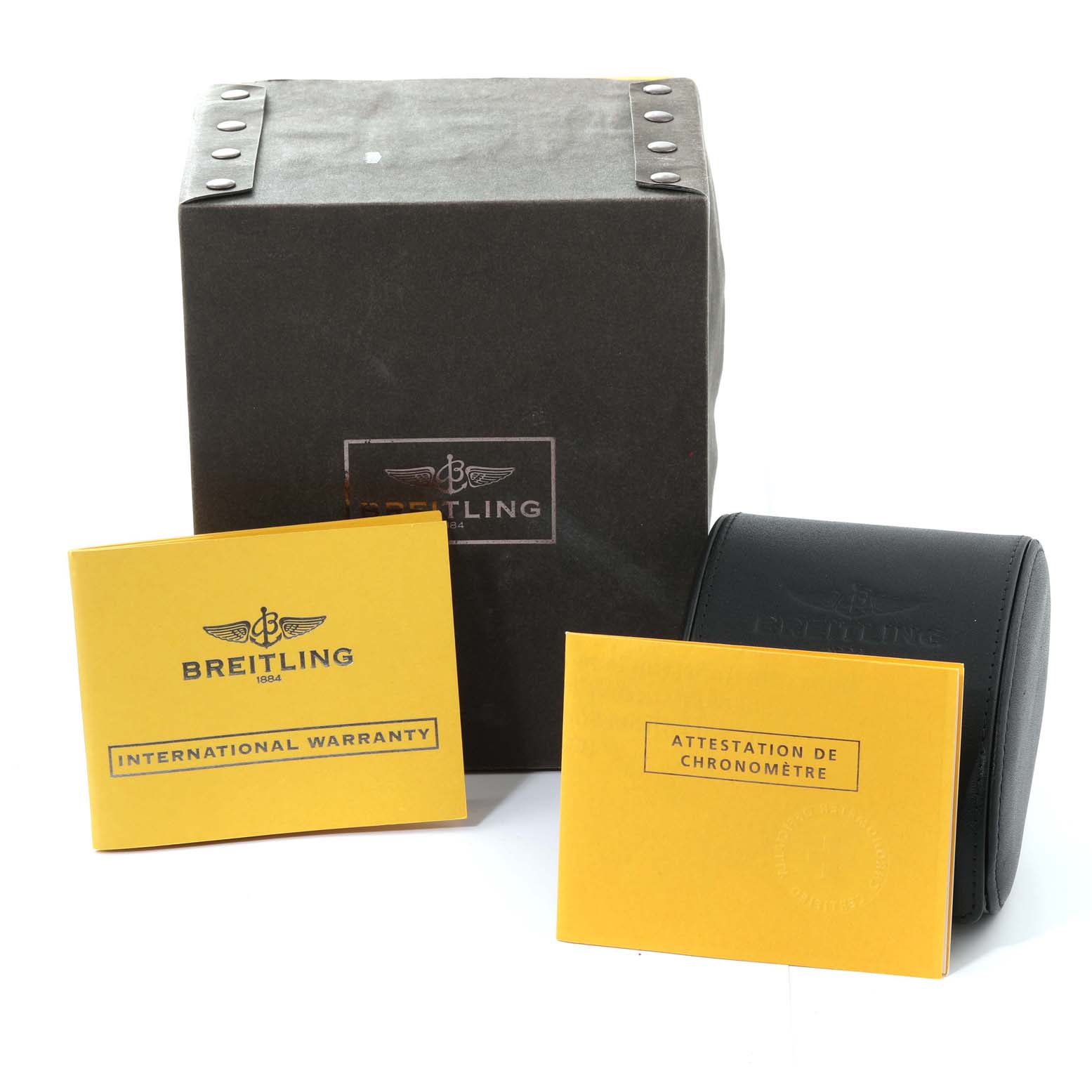 The image shows the packaging and warranty documents of a Breitling Superocean A17364 Men's Stainless Steel Black Dial A17364 Men's Stainless Steel Black Dial watch, including the International Warranty and Chronometer certificate.