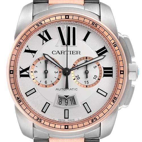 The image shows a front view of the Calibre de Cartier watch, highlighting the dial, Roman numerals, and chronograph subdials.