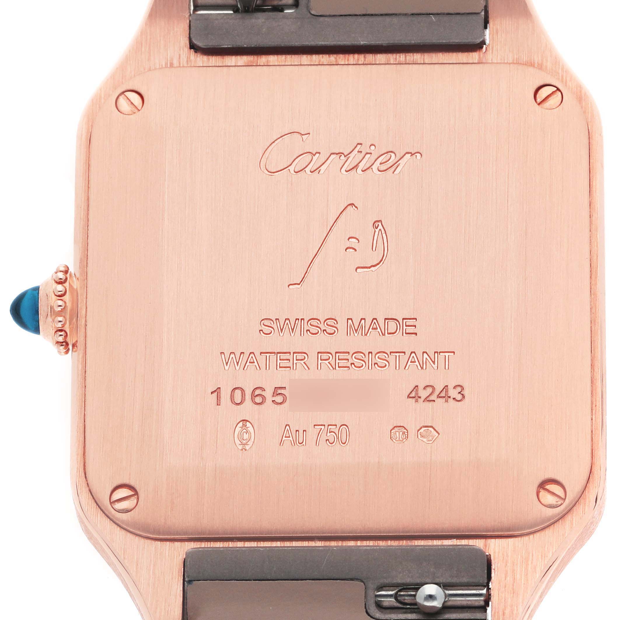 The image shows the back casing of a Cartier Santos Dumont WGSA0022 Men
s Rose Gold Silver Dial WGSA0022 Men
s Rose Gold Silver Dial watch with inscriptions and the crown on the side.