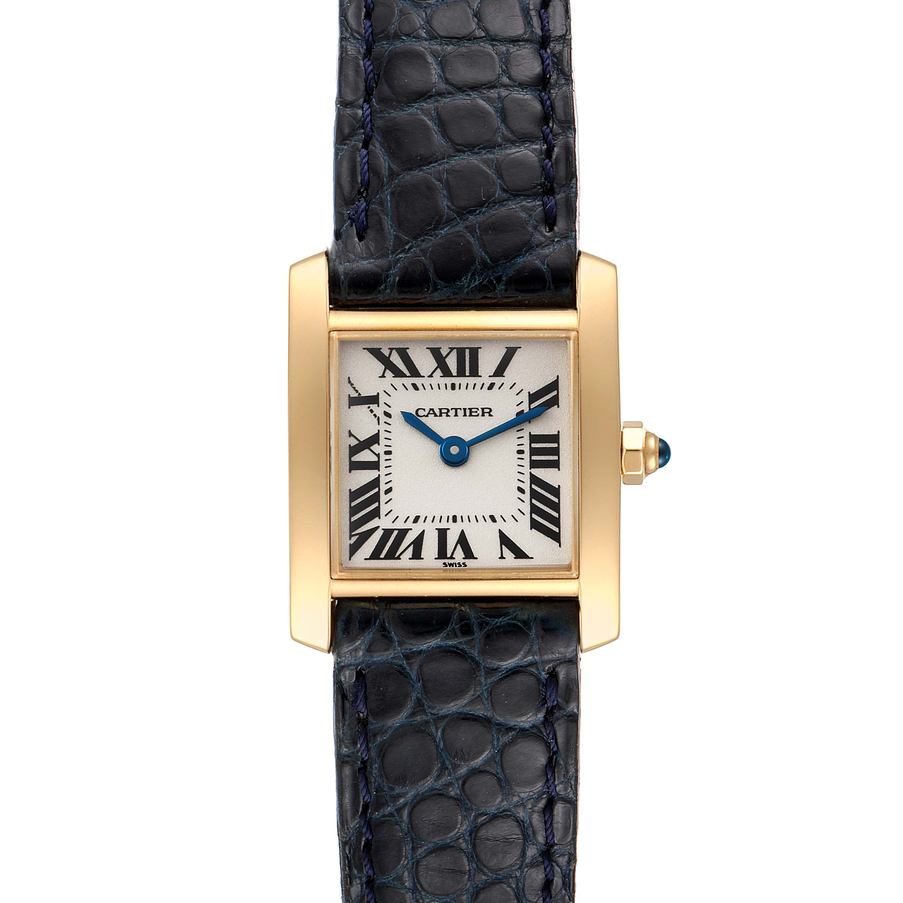 The Cartier Tank Francaise W5000256 Women's Yellow Gold Silver Dial W5000256 Women's Yellow Gold Silver Dial watch is shown from a top-down angle, displaying its face, blue hands, gold case, and leather strap.