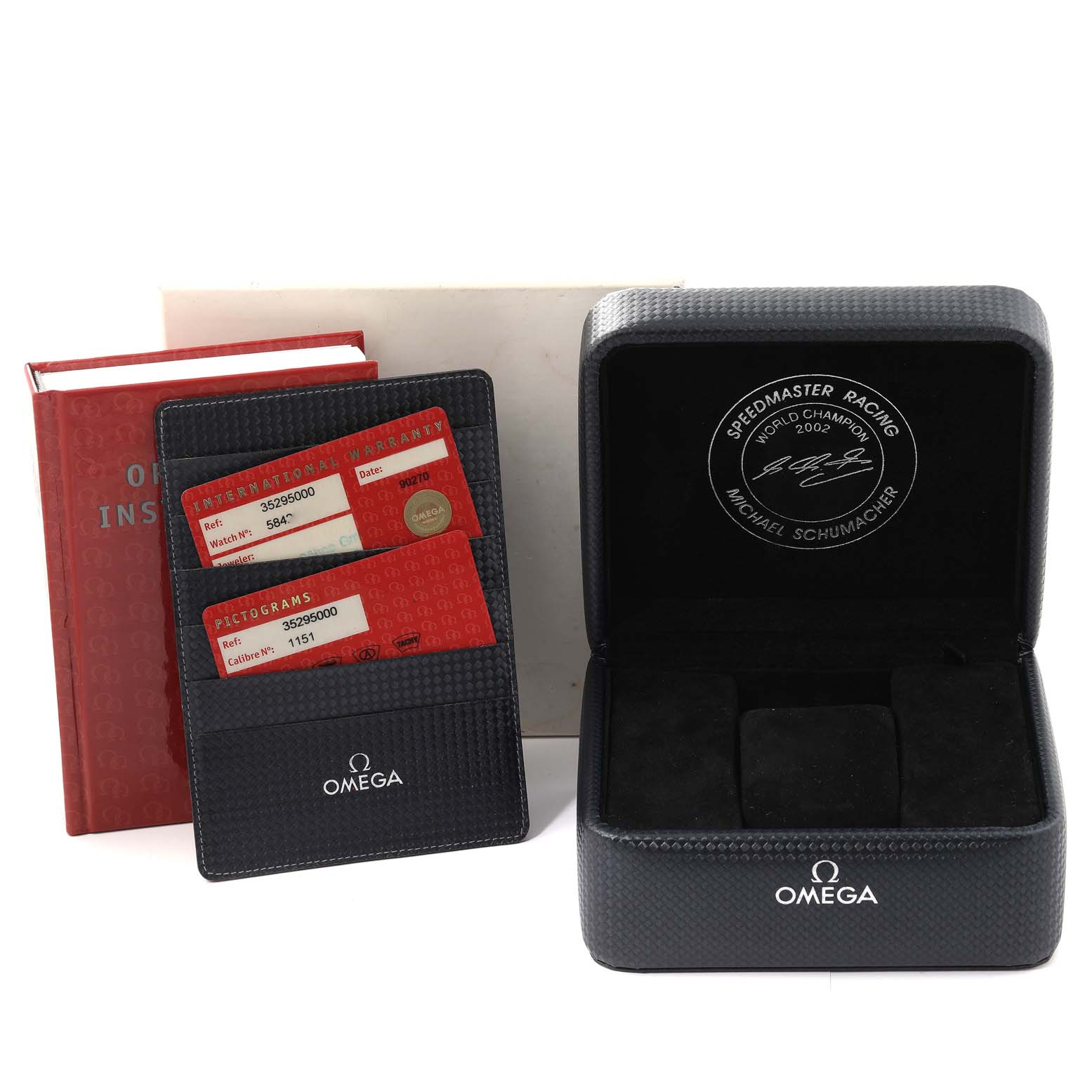 The image shows the Omega Speedmaster 3529.50.00 Men's Stainless Steel Black Dial 3529.50.00 Men's Stainless Steel Black Dial watch's packaging, warranty cards, and instruction manual from a side angle.