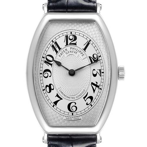 The Patek Philippe Gondolo watch is shown from a front angle, highlighting its dial, numerals, bezel, and crown.