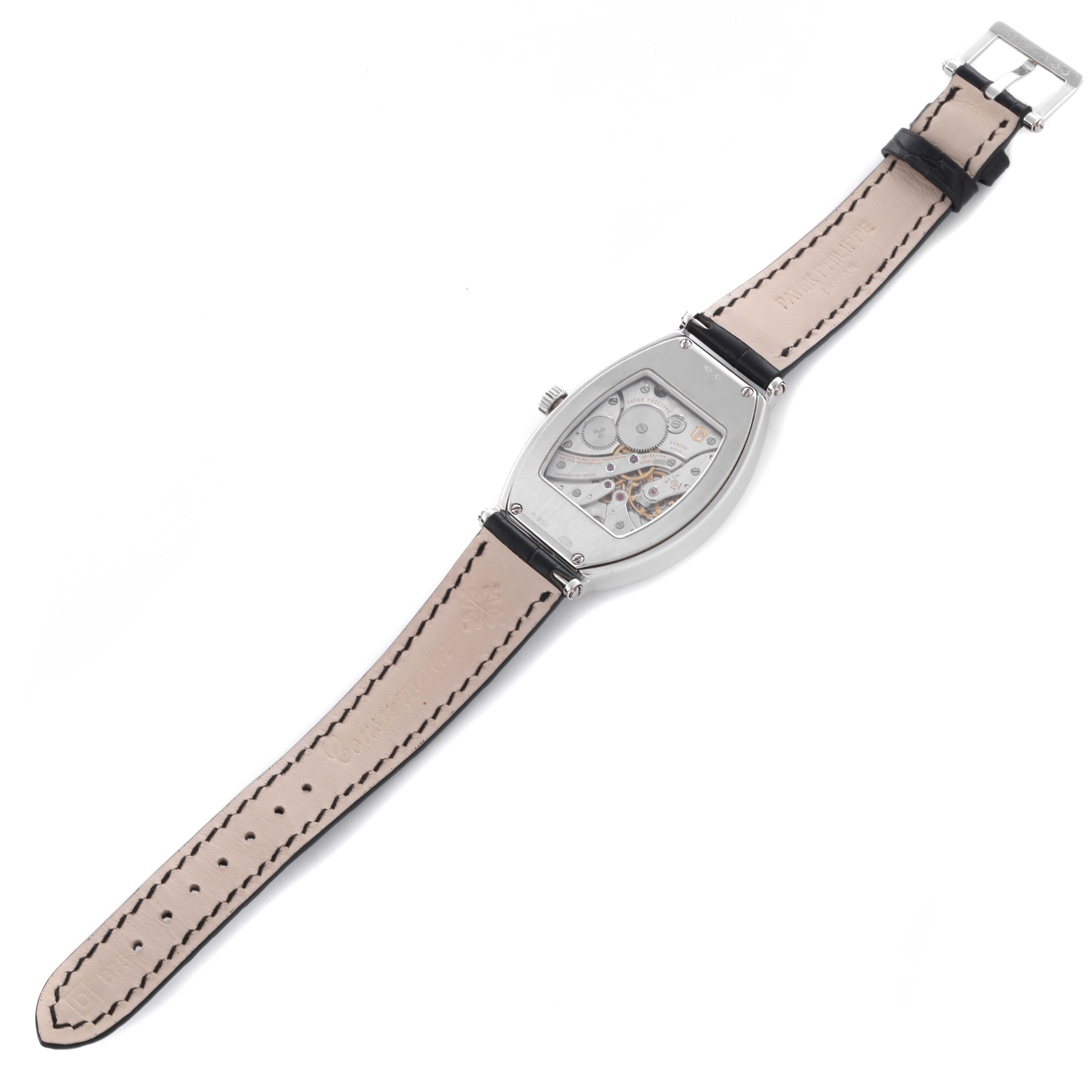 The Patek Philippe Gondolo 5098P-001 Men's Platinum Silver Dial 5098P-001 Men's Platinum Silver Dial watch is shown from the back, displaying the inner mechanics and full leather strap.